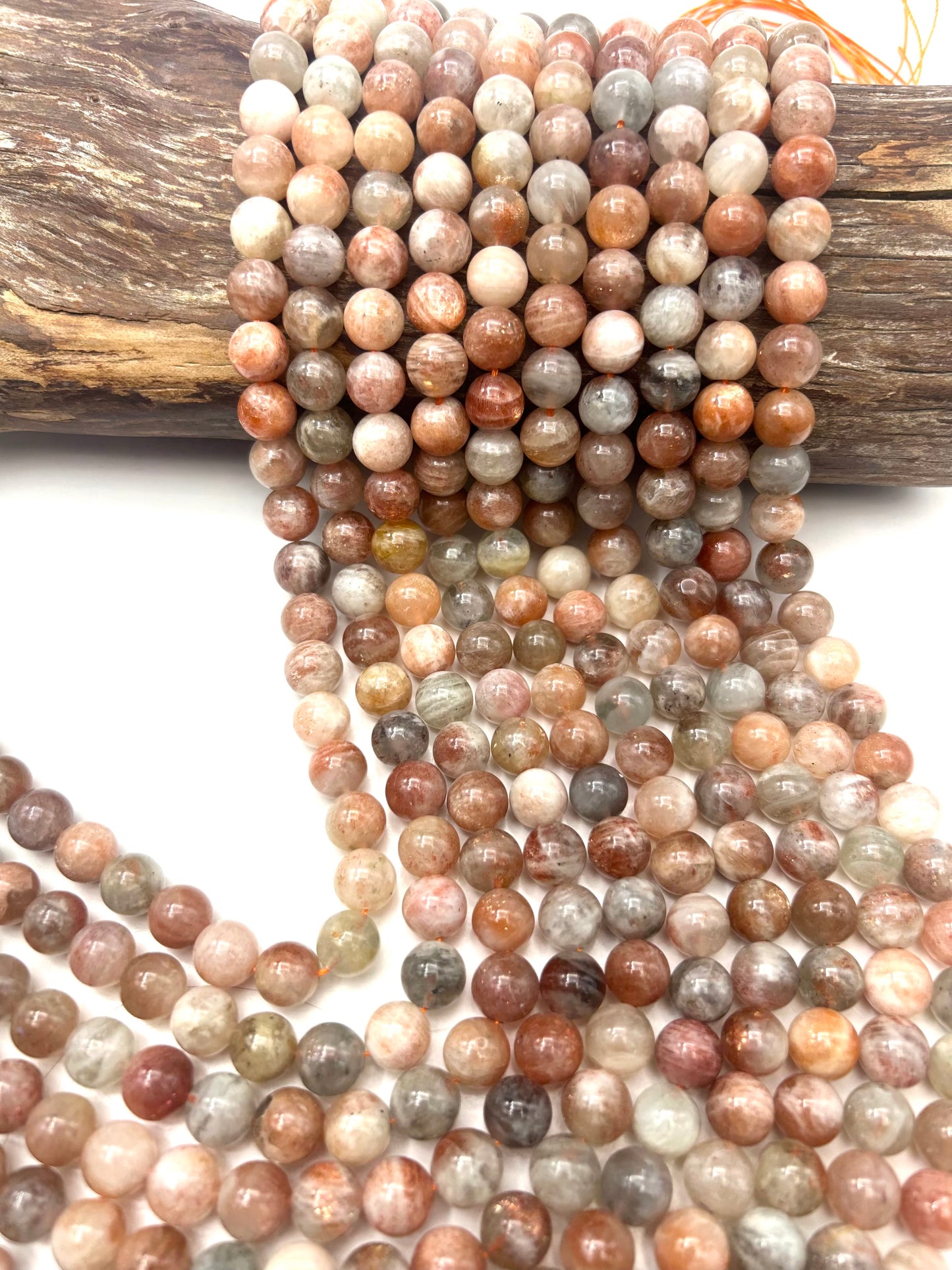 AAA Natural Silver sunstone bead. 6mm,8mm,10mm round smooth Gorgeous natural silver, dusty rose color . Stunning looking bead!