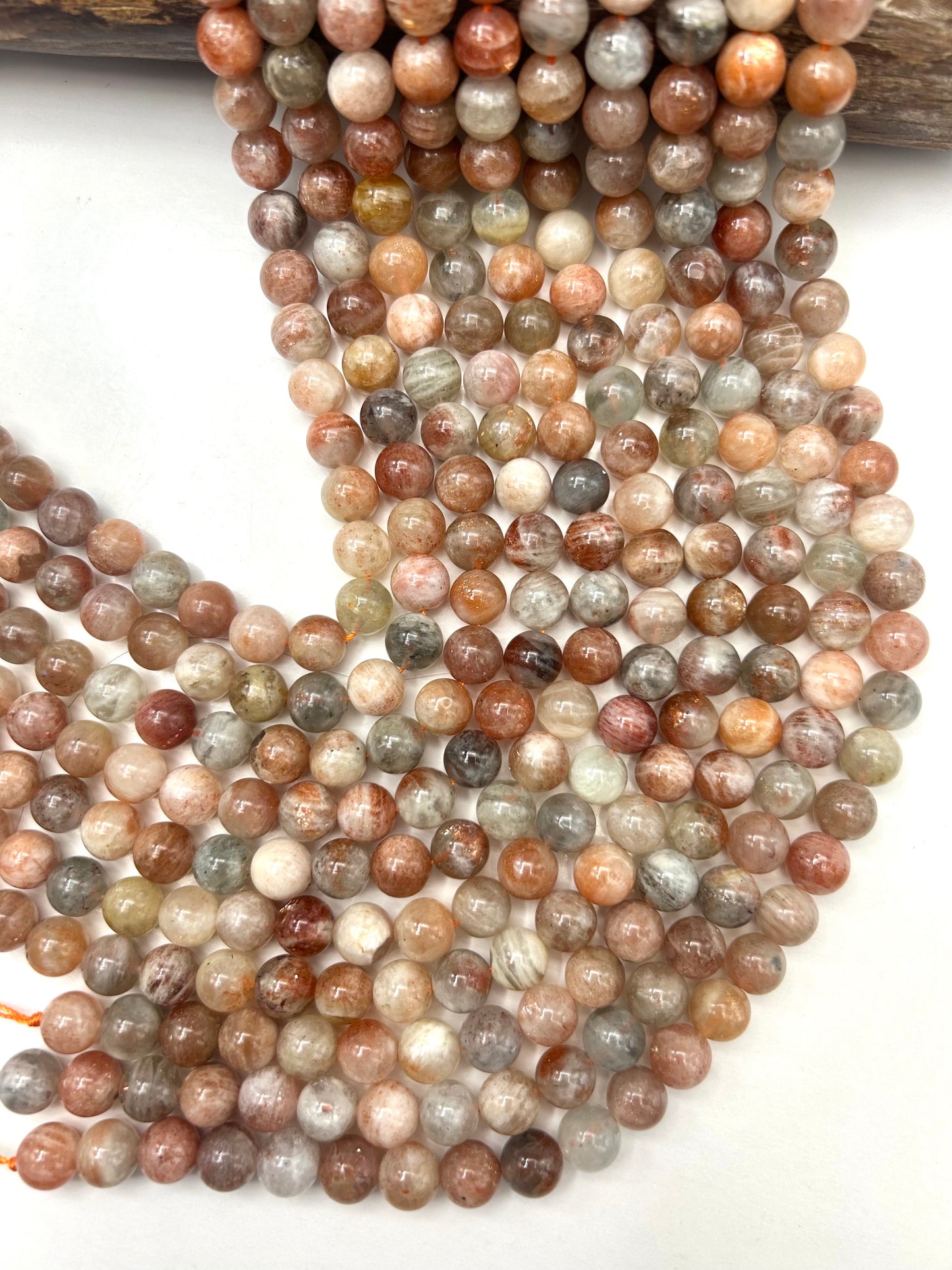 AAA Natural Silver sunstone bead. 6mm,8mm,10mm round smooth Gorgeous natural silver, dusty rose color . Stunning looking bead!