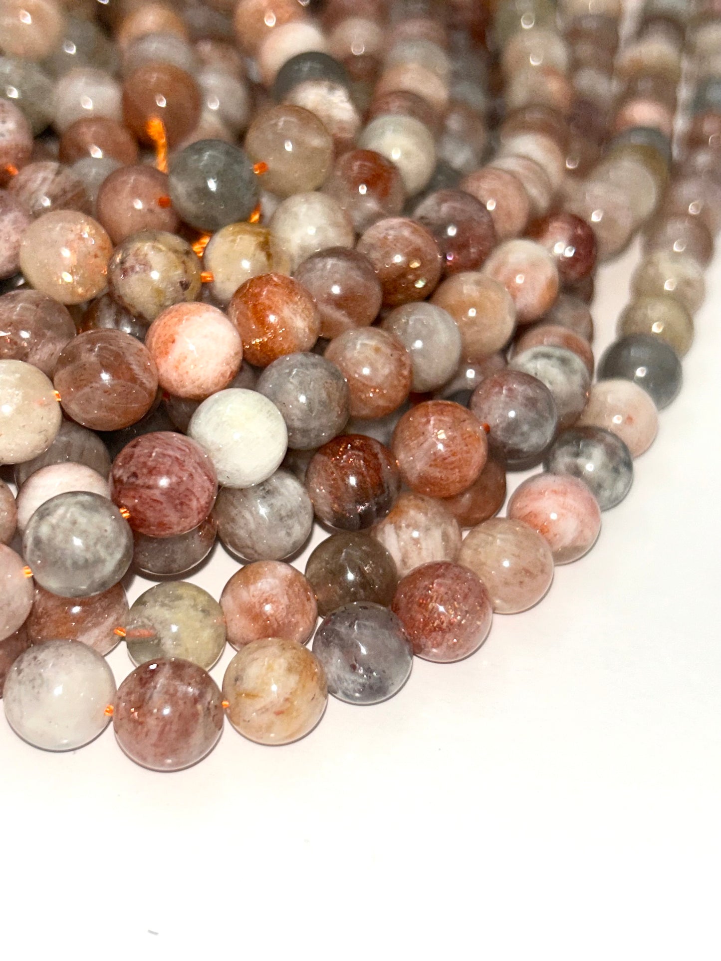 AAA Natural Silver sunstone bead. 6mm,8mm,10mm round smooth Gorgeous natural silver, dusty rose color . Stunning looking bead!
