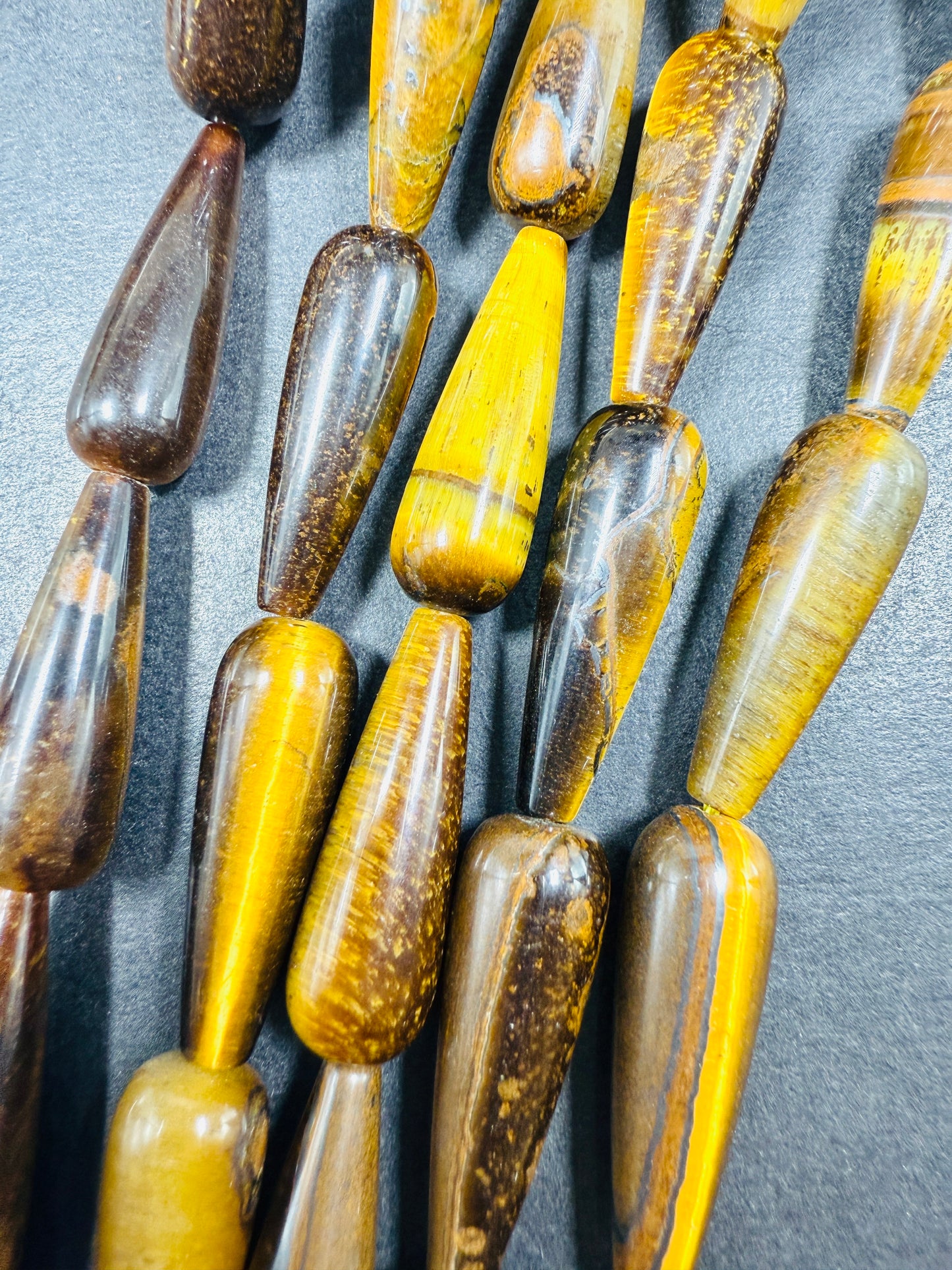 Natural Tiger eye stone bead. 30x10mm Teardrop Shape bead. Gorgeous natural brown yellow color. Full Strand 15.5".