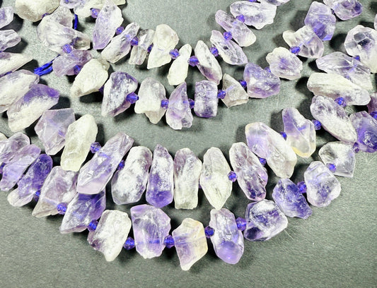 Natural Amethyst stone bead . Rough-cut teardrop shape bead 18mm. Gorgeous natural purple lavender color. Full strand 15.5”
