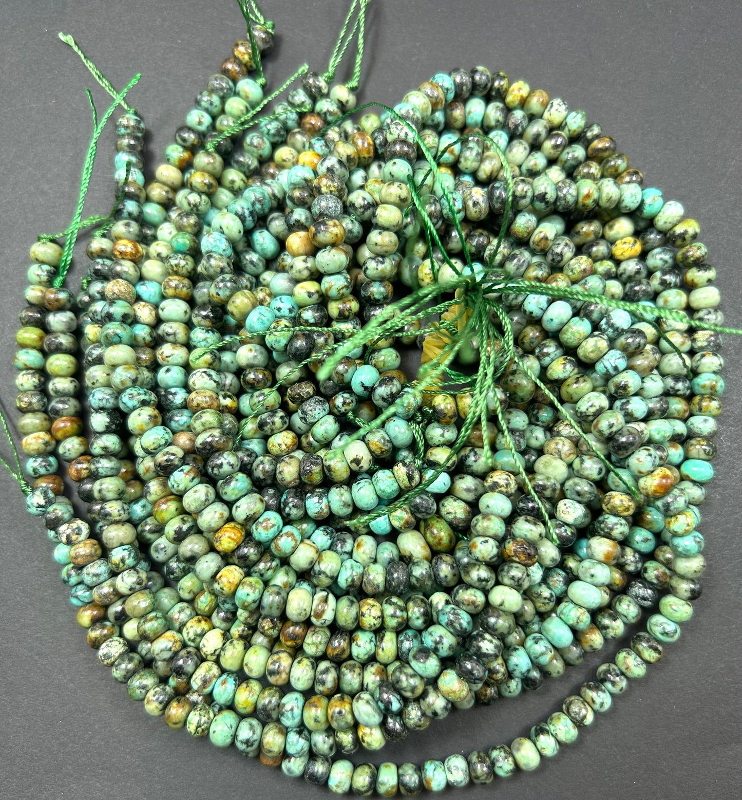 AAA Natural African turquoise smooth roundel stone bead. 6 x 4.5 mm bead . Gorgeous natural turquoise green blue with black points Gemstone,