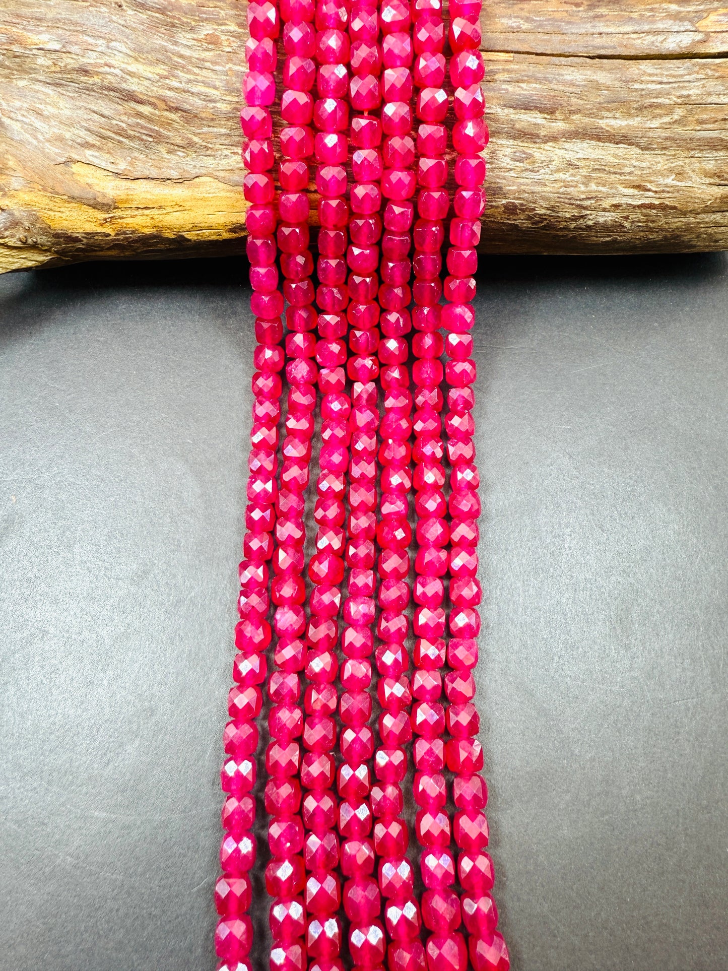 Natural Ruby jade bead . Faceted 6mm cube shape bead. Beautiful natural Hot Pink Ruby Color. Full strand 15.5”