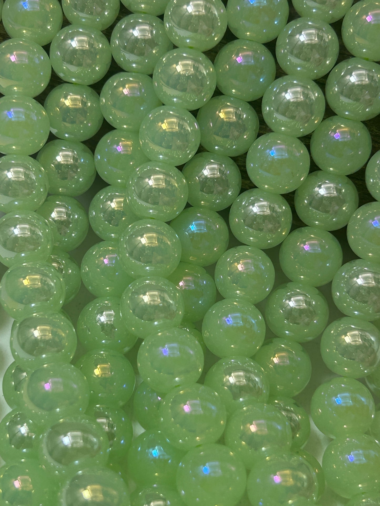 Beautiful Chinese crystal. Smooth Round shape bead. Gorgeous green with iridescent rainbow colors, great quality crystal full strand