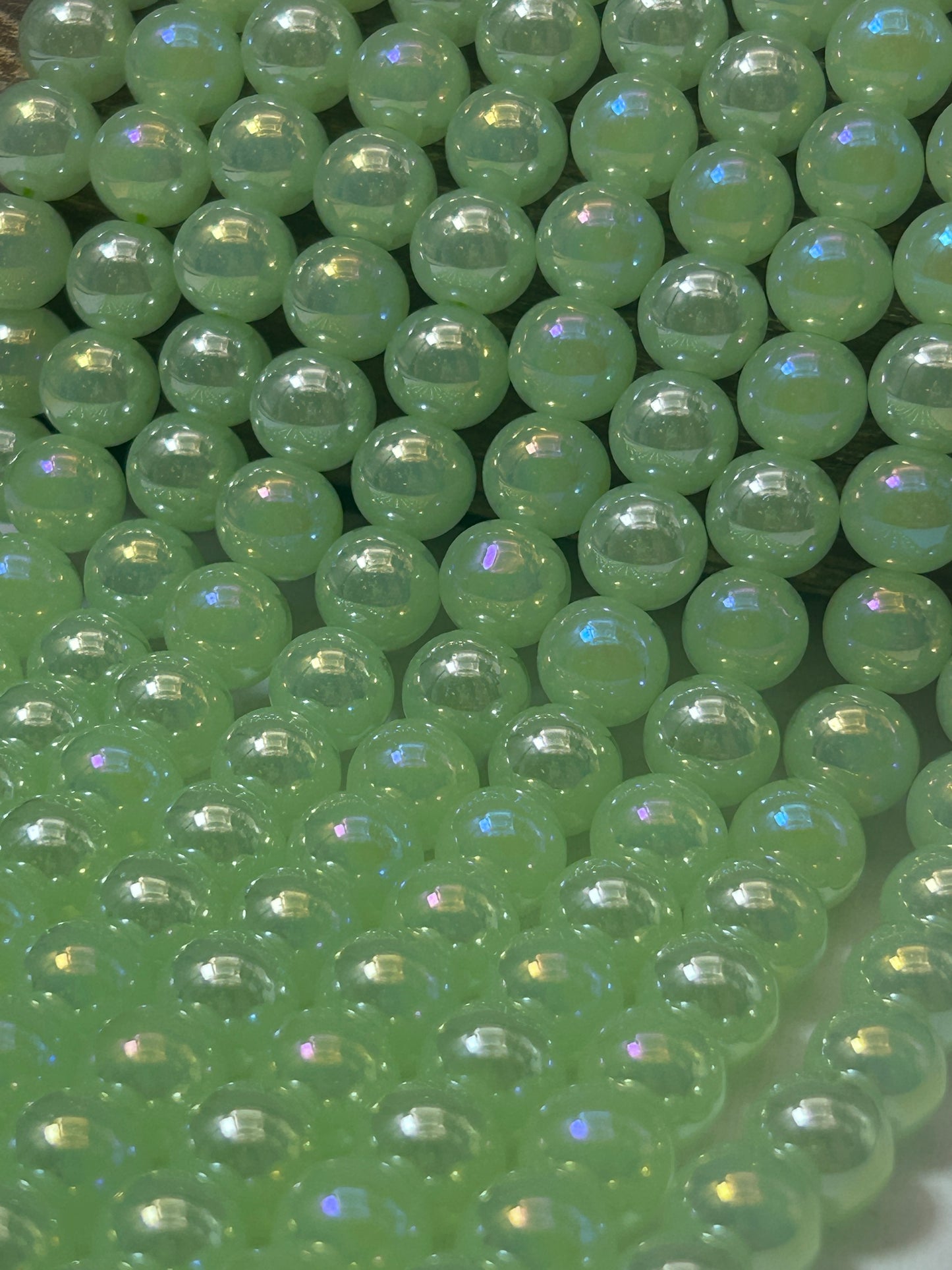 Beautiful Chinese crystal. Smooth Round shape bead. Gorgeous green with iridescent rainbow colors, great quality crystal full strand