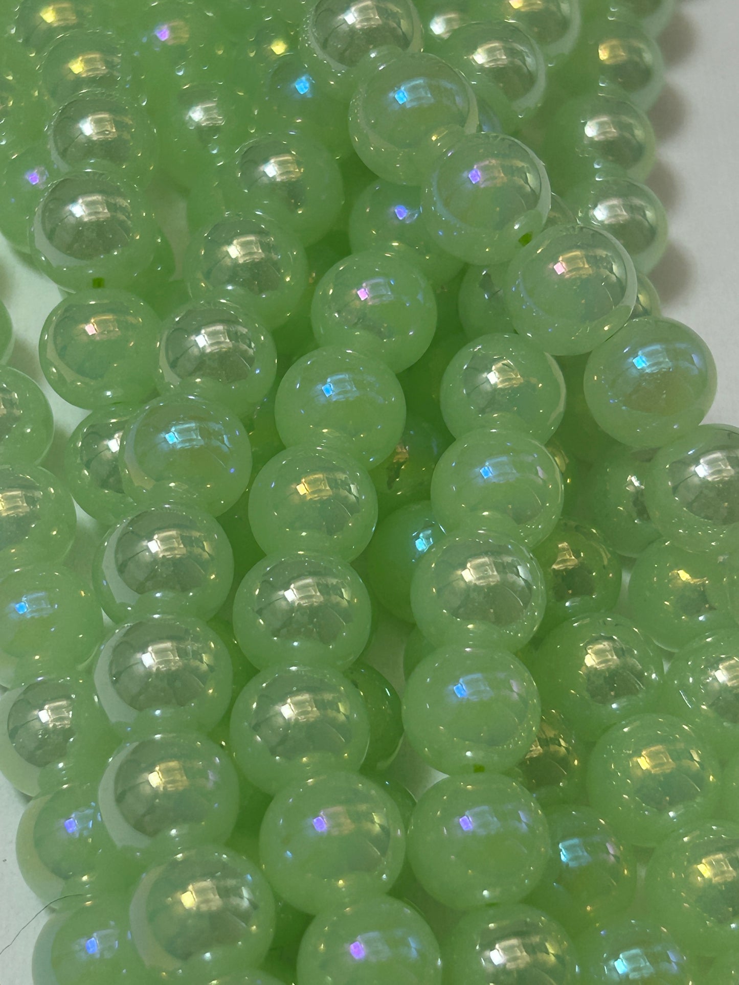 Beautiful Chinese crystal. Smooth Round shape bead. Gorgeous green with iridescent rainbow colors, great quality crystal full strand