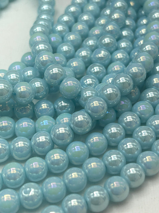 Beautiful Chinese crystal. Smooth Round shape bead. Gorgeous light blue with iridescent rainbow colors, great quality crystal full strand
