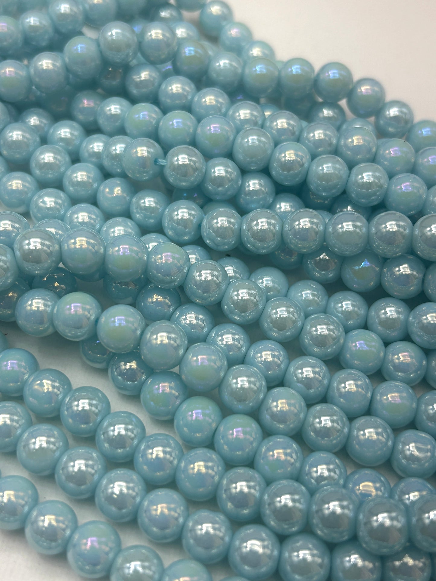Beautiful Chinese crystal. Smooth Round shape bead. Gorgeous light blue with iridescent rainbow colors, great quality crystal full strand