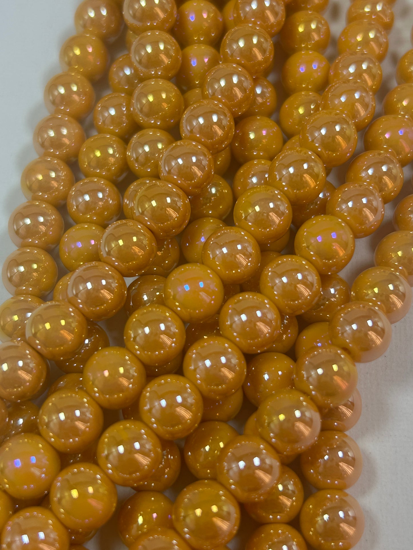 Beautiful Chinese crystal. Smooth Round shape bead. Gorgeous orange with iridescent rainbow colors, great quality crystal full strand