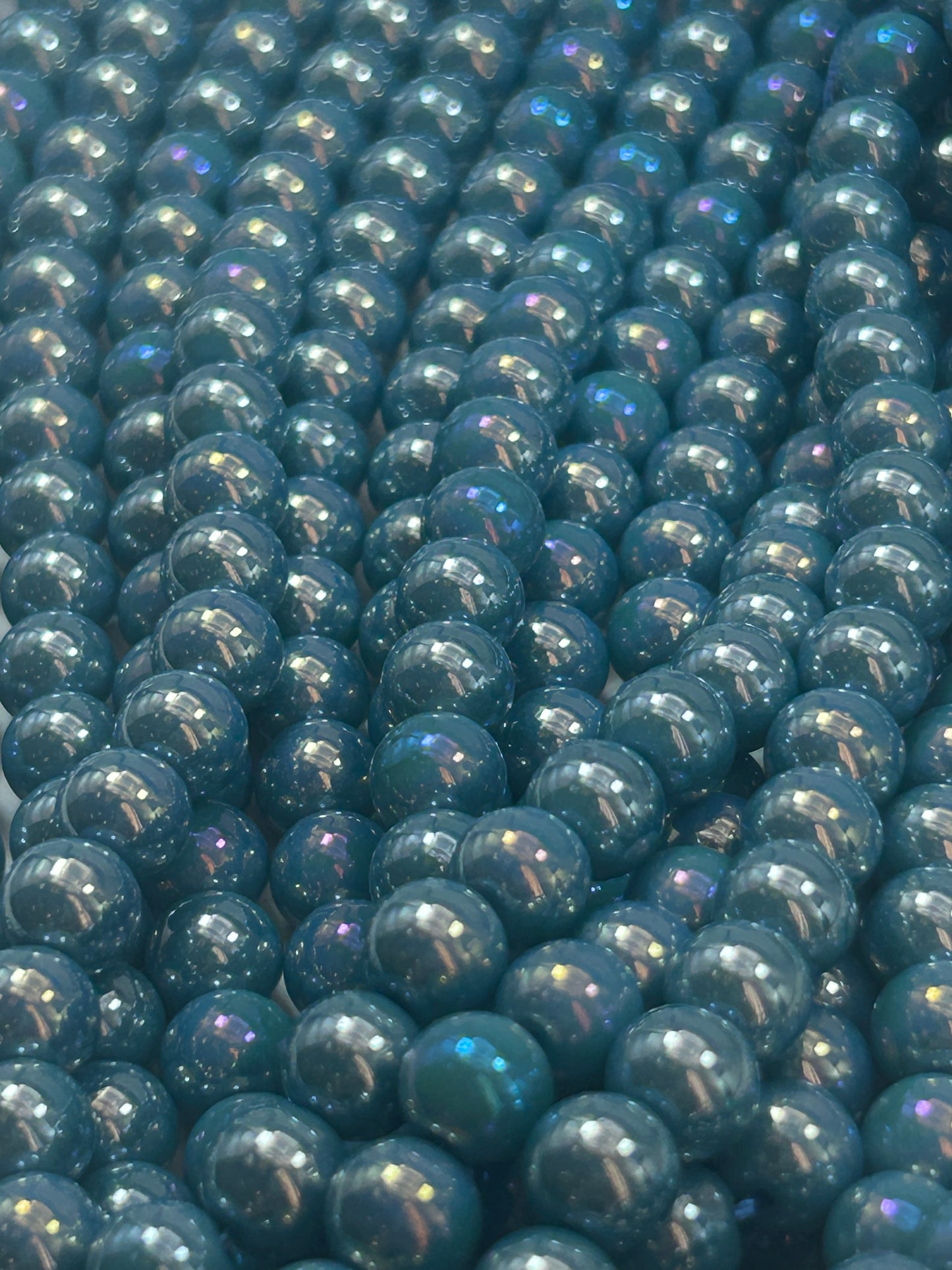 Beautiful Chinese crystal. Smooth Round shape bead. Gorgeous turquoise with iridescent rainbow colors, great quality crystal full strand