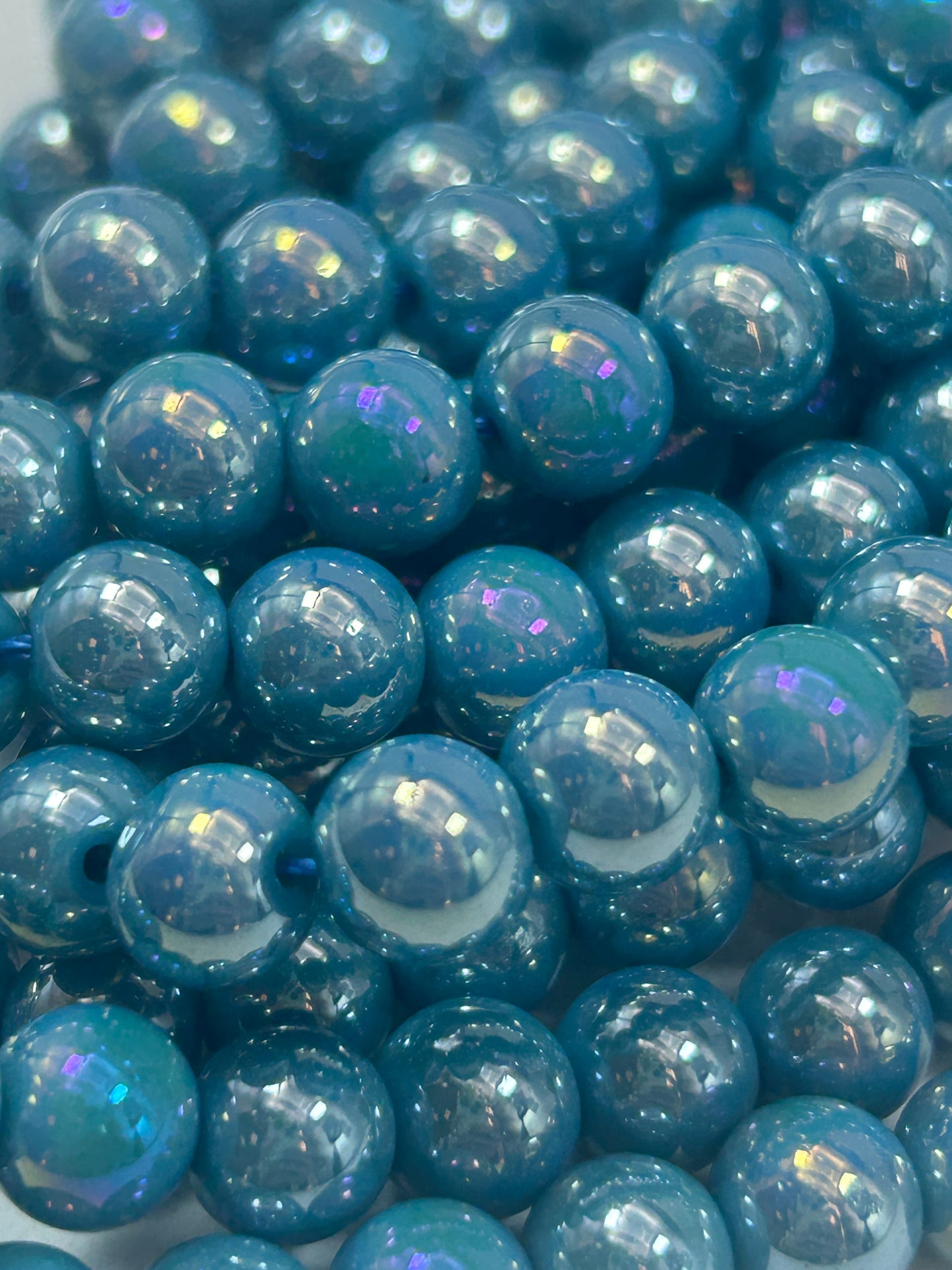 Beautiful Chinese crystal. Smooth Round shape bead. Gorgeous turquoise with iridescent rainbow colors, great quality crystal full strand