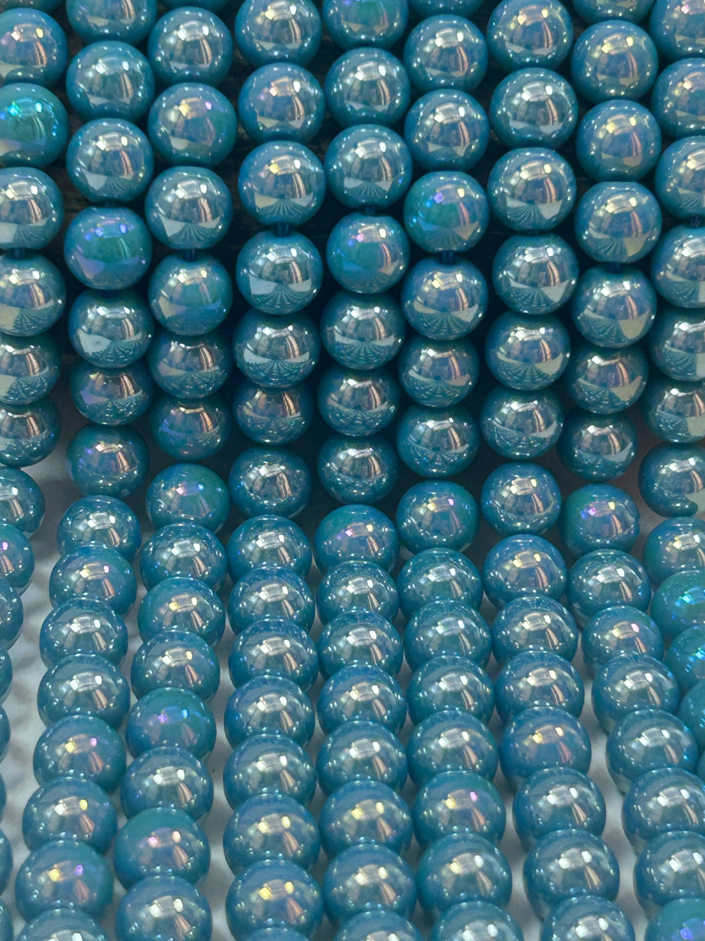 Beautiful Chinese crystal. Smooth Round shape bead. Gorgeous turquoise with iridescent rainbow colors, great quality crystal full strand