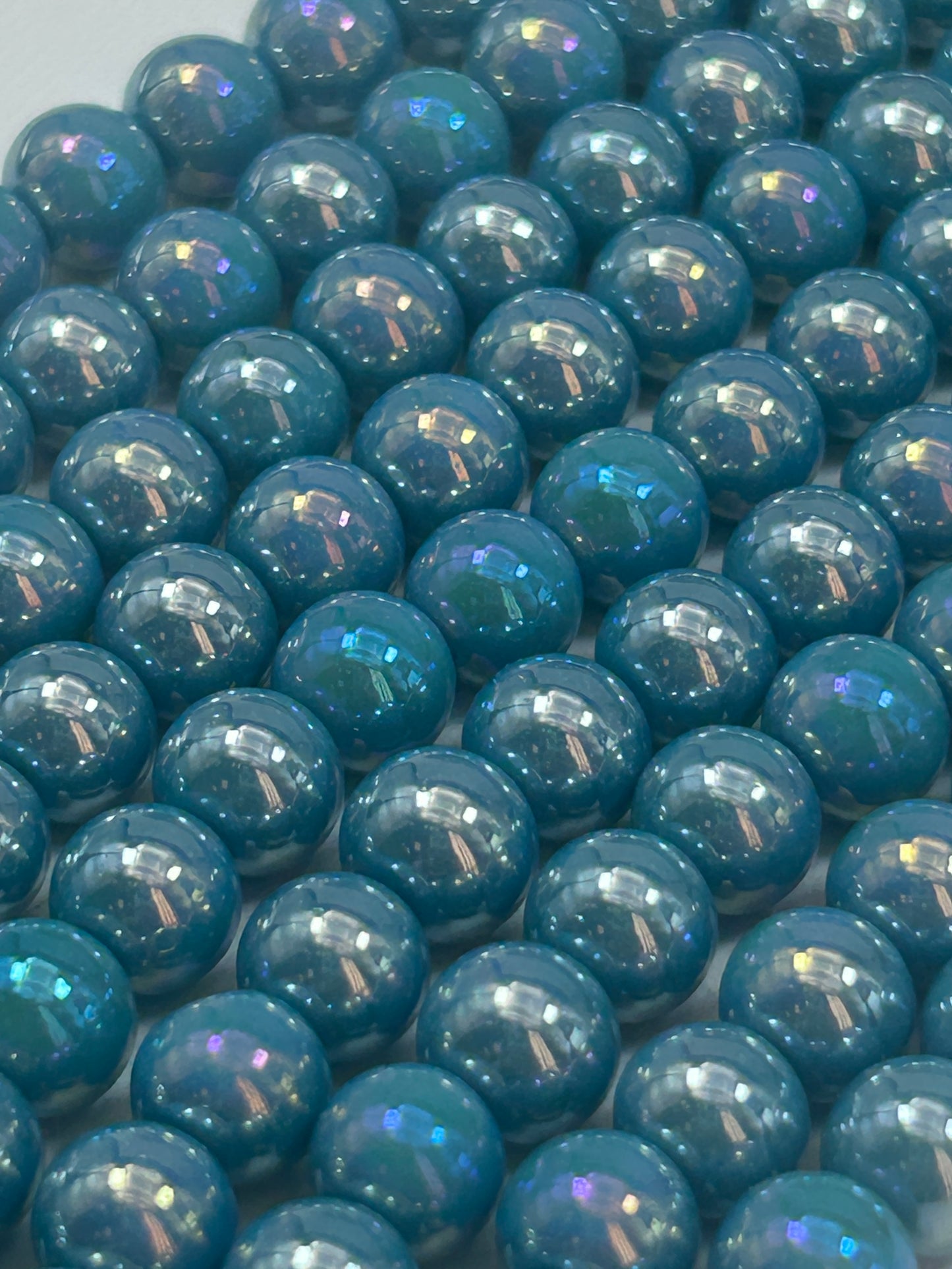 Beautiful Chinese crystal. Smooth Round shape bead. Gorgeous turquoise with iridescent rainbow colors, great quality crystal full strand