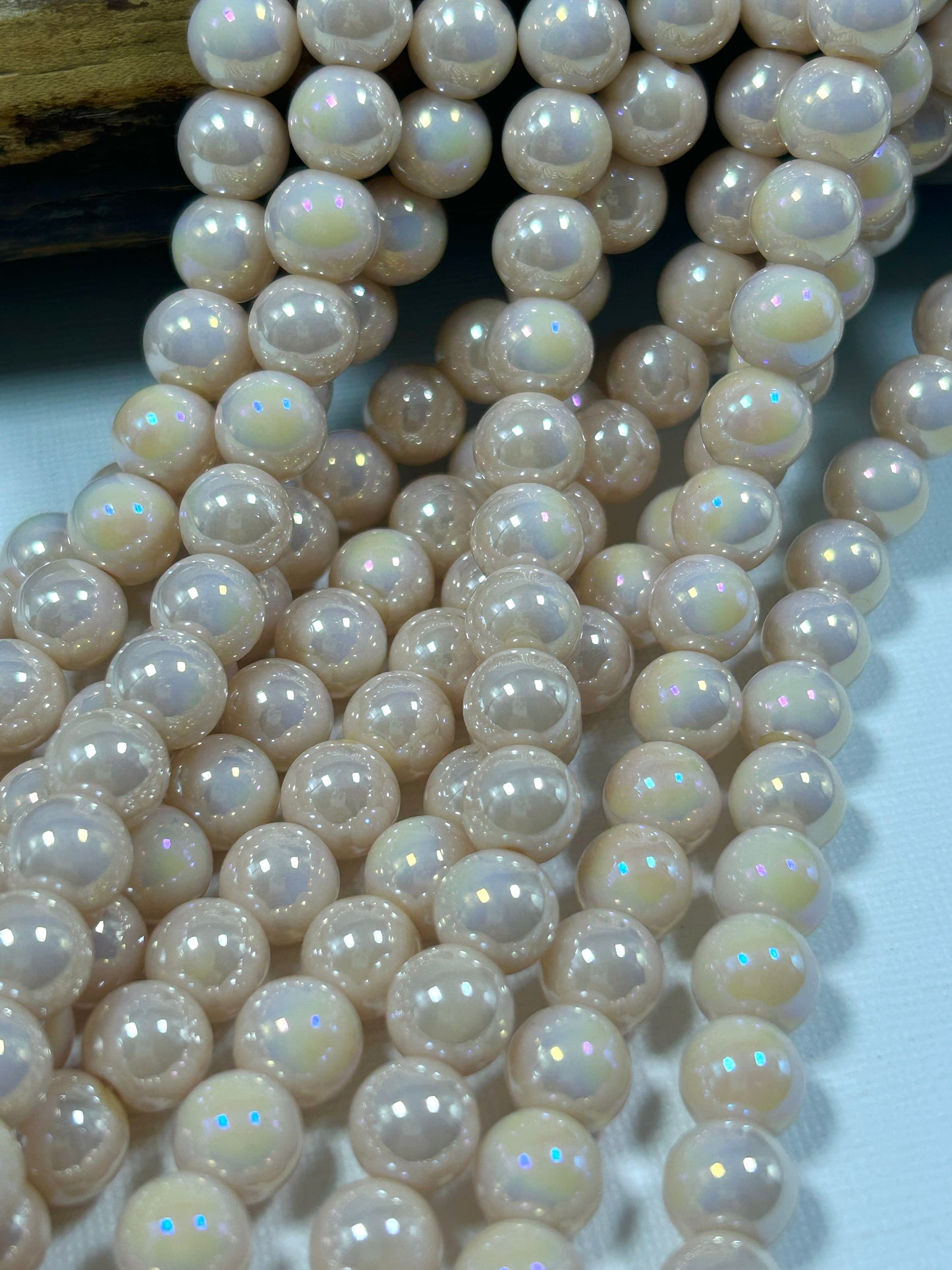 Beautiful Chinese crystal. Smooth Round shape bead. Gorgeous peachy pink with iridescent rainbow colors, great quality crystal full strand