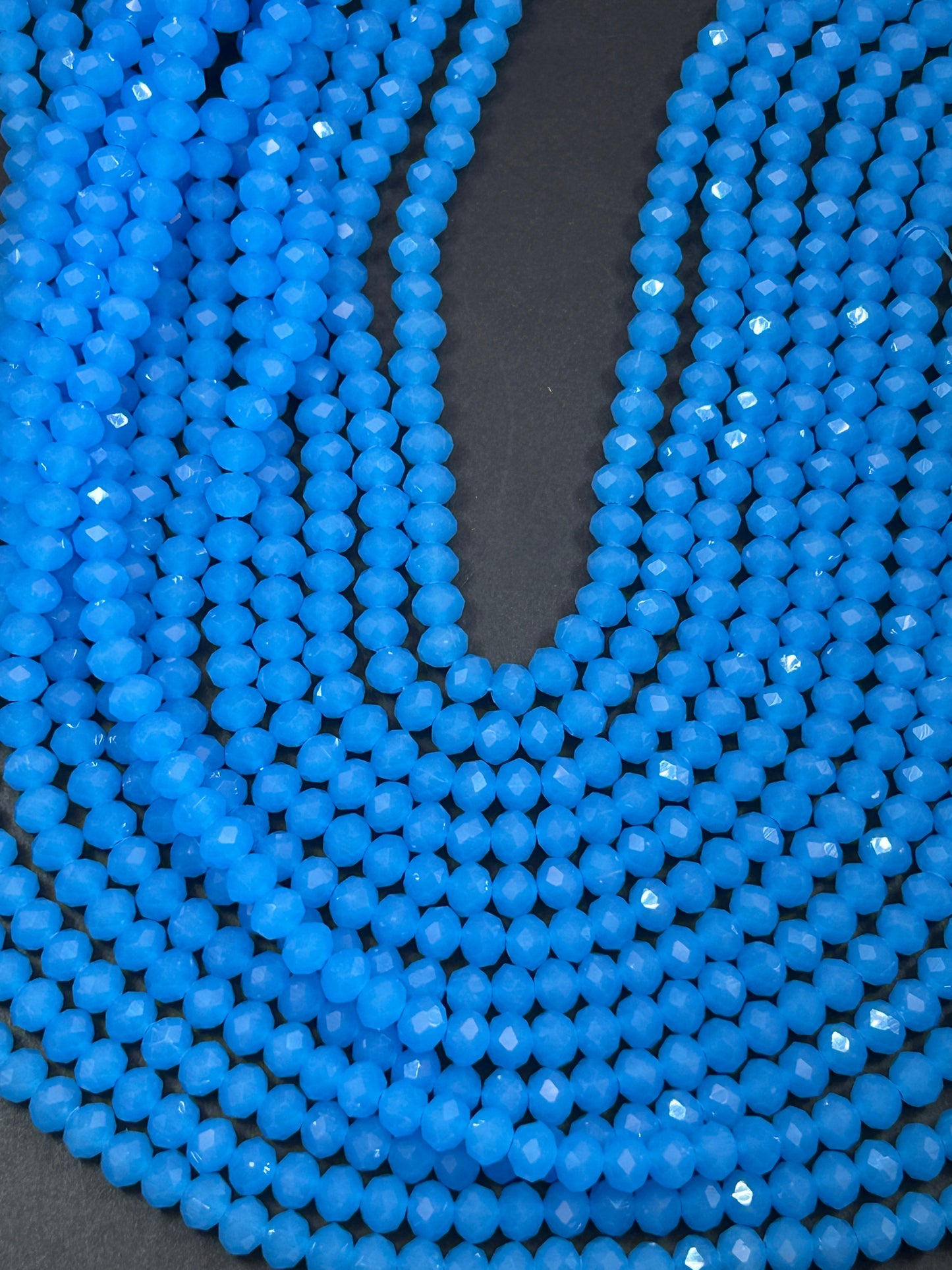Beautiful Chinese crystal. Faceted Rondelle shape bead. Gorgeous aquamarine blue, iridescent rainbow color. Great quality glass full strand