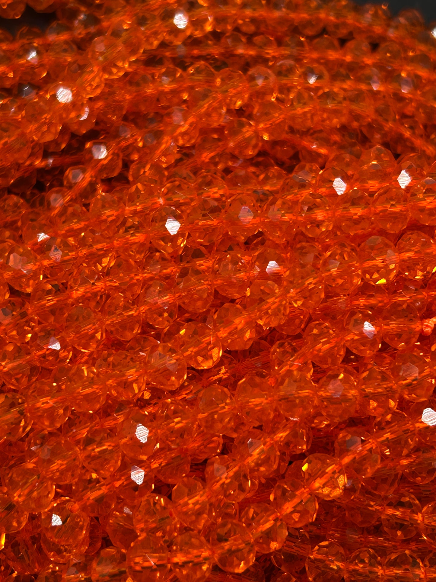 Beautiful Chinese crystal. Faceted Rondelle shape bead. Gorgeous orange iridescent rainbow color. Great quality glass full strand