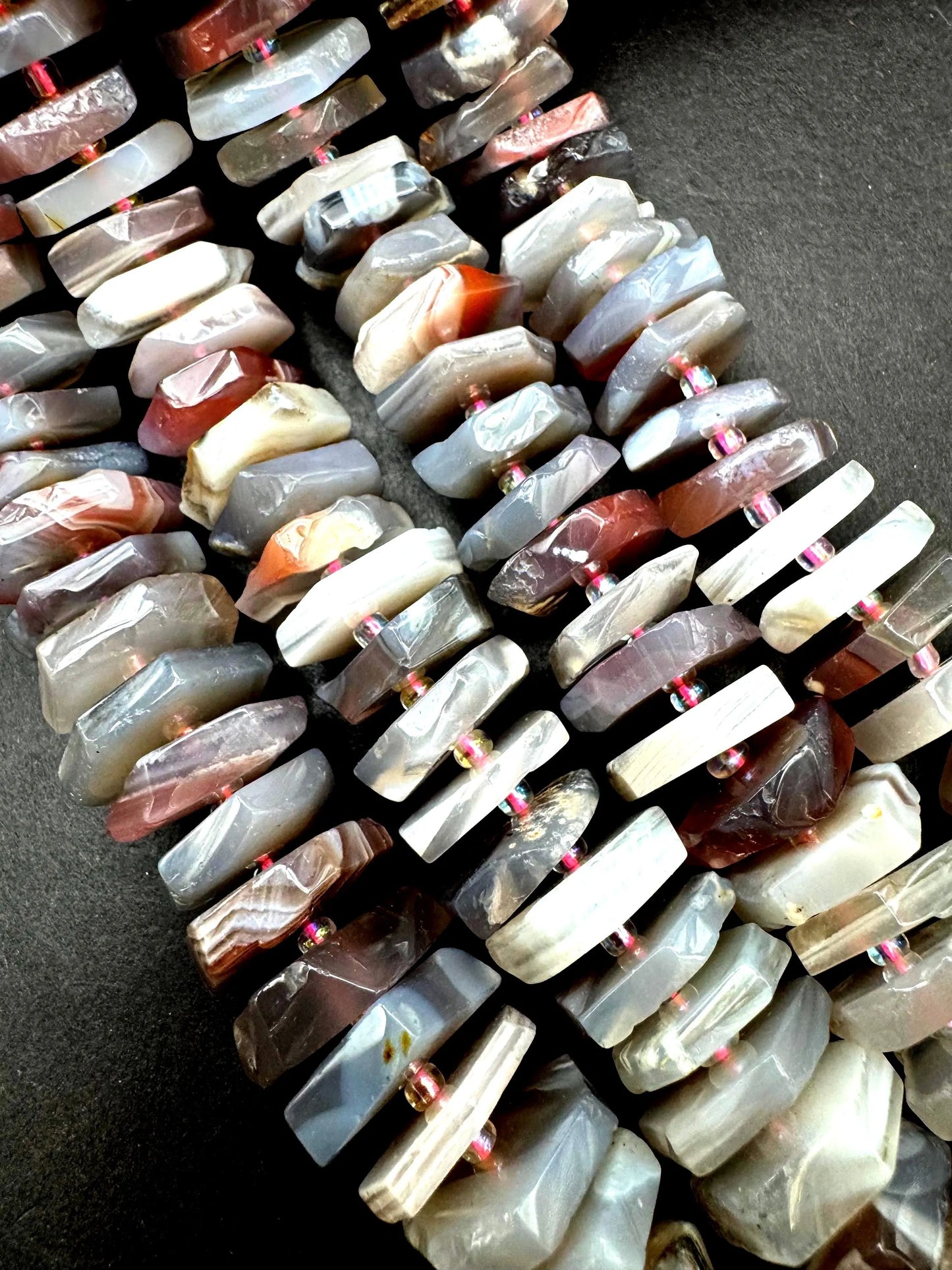 Natural Botswana gemstone bead. pinwheel shape . Gorgeous natural pink purple grayish color. Full strand 15.5”