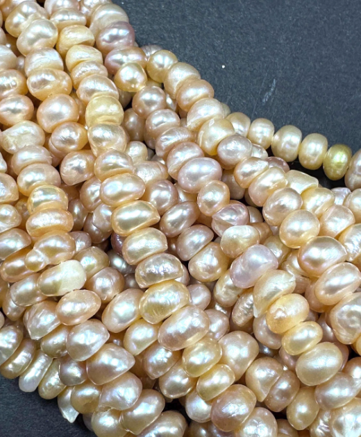 Natural fresh water pearls beads. Natural cream pink color . Excellent quality.  Full strand.