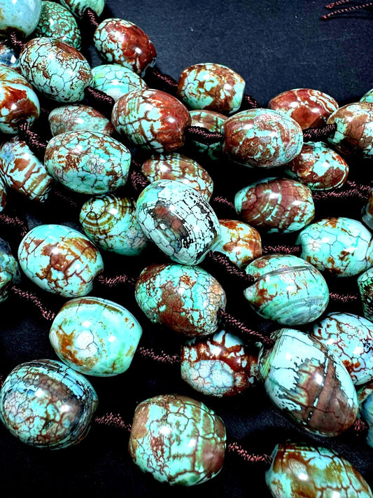 Natural Tibetan gemstone bead. barrel shape . gorgeous turquoise blue color with brown. excellent quality. full strand 15.5”