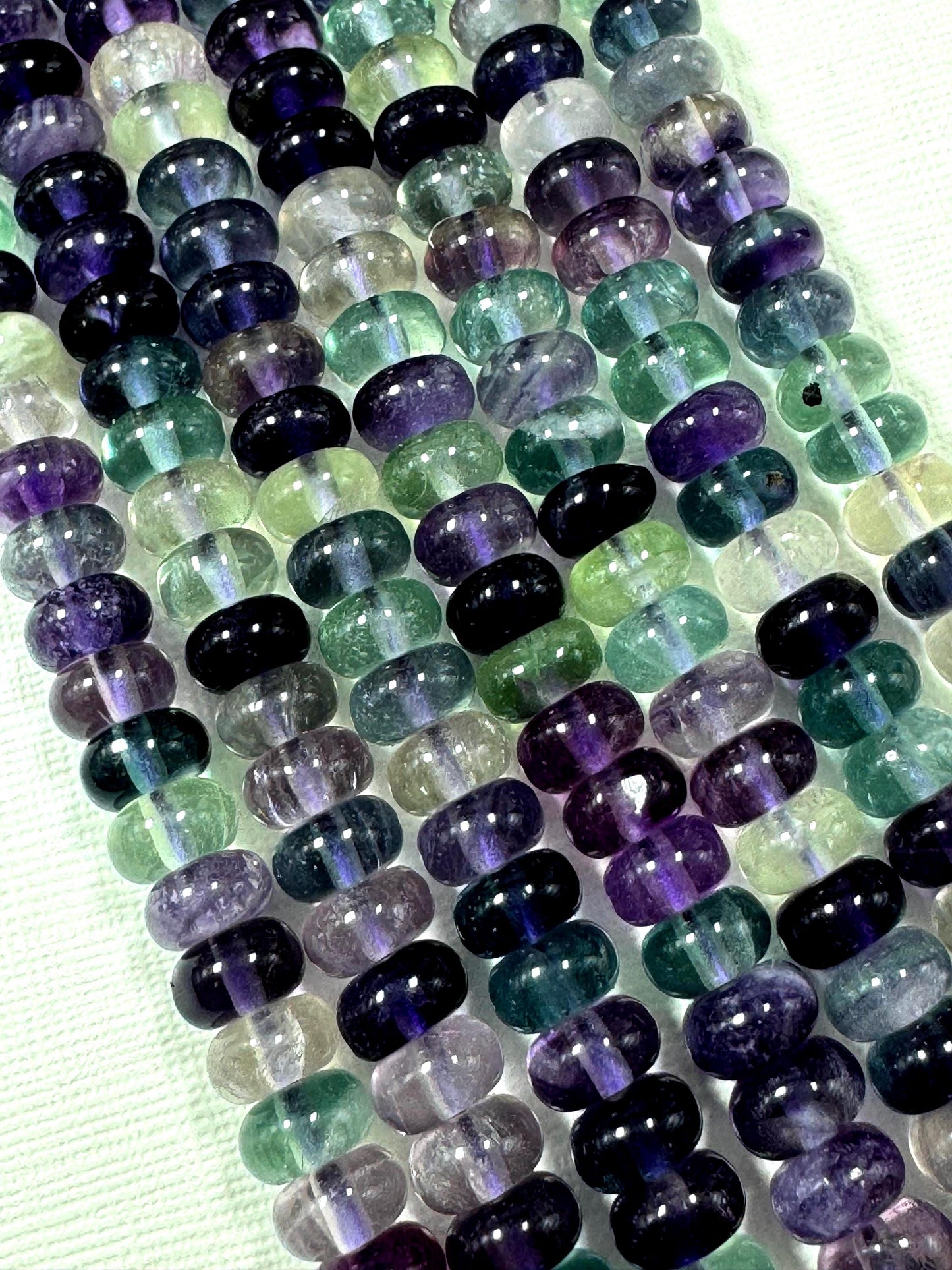 AAA Natural fluorite gemstone bead. Roundell shape .Gorgeous Natural purple green color. excellent quality. full strand 15.5”