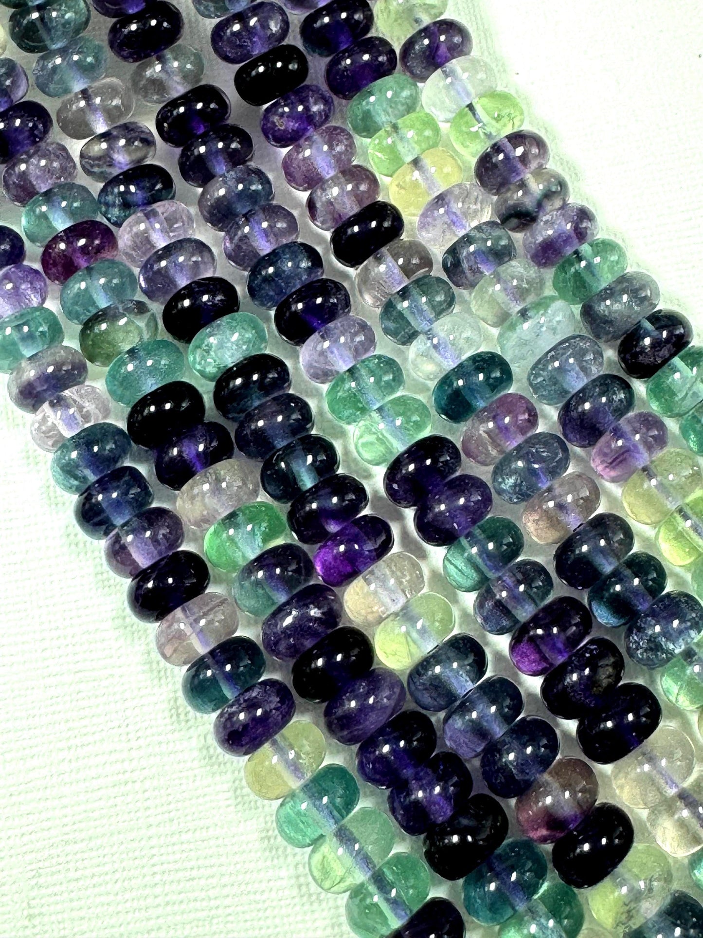 AAA Natural fluorite gemstone bead. Roundell shape .Gorgeous Natural purple green color. excellent quality. full strand 15.5”