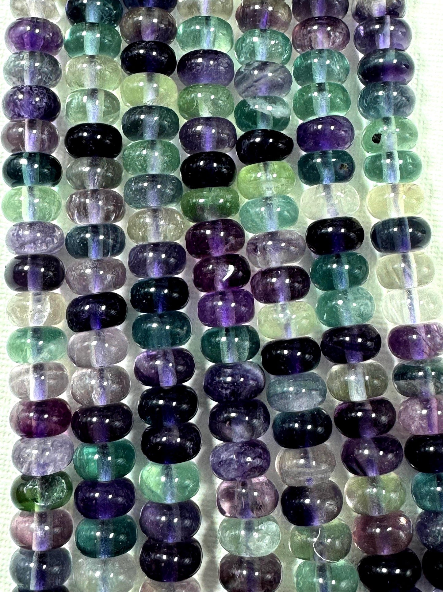 AAA Natural fluorite gemstone bead. Roundell shape .Gorgeous Natural purple green color. excellent quality. full strand 15.5”