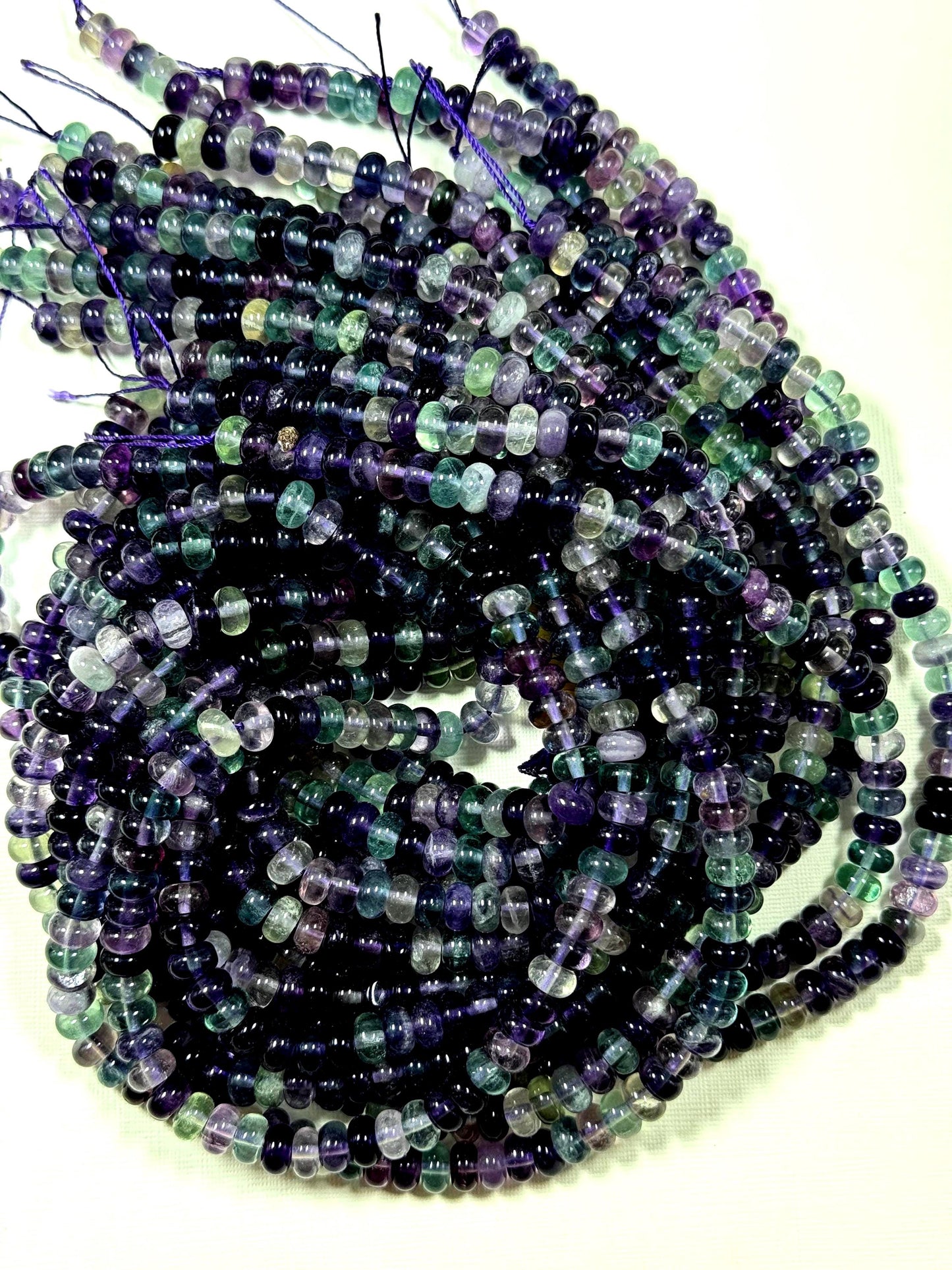 AAA Natural fluorite gemstone bead. Roundell shape .Gorgeous Natural purple green color. excellent quality. full strand 15.5”