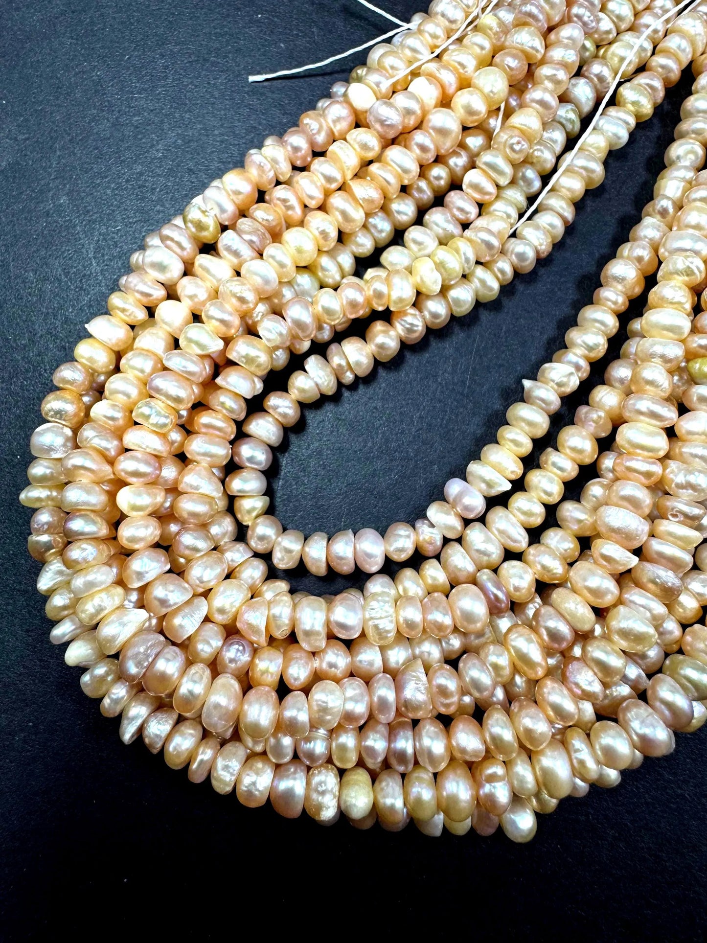 Natural fresh water pearls beads. Natural cream pink color . Excellent quality. Full strand.