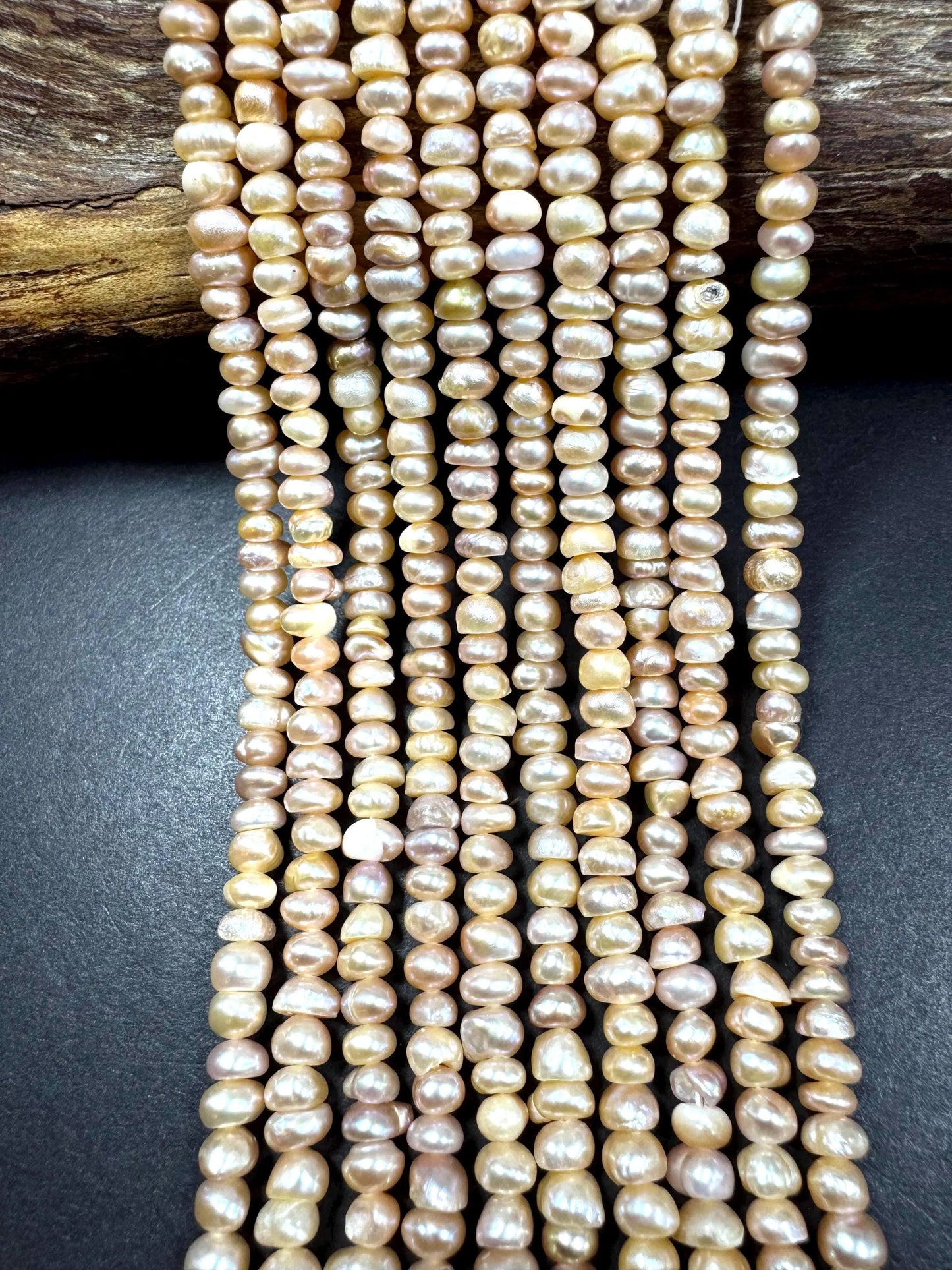 Natural fresh water pearls beads. Natural cream pink color . Excellent quality. Full strand.