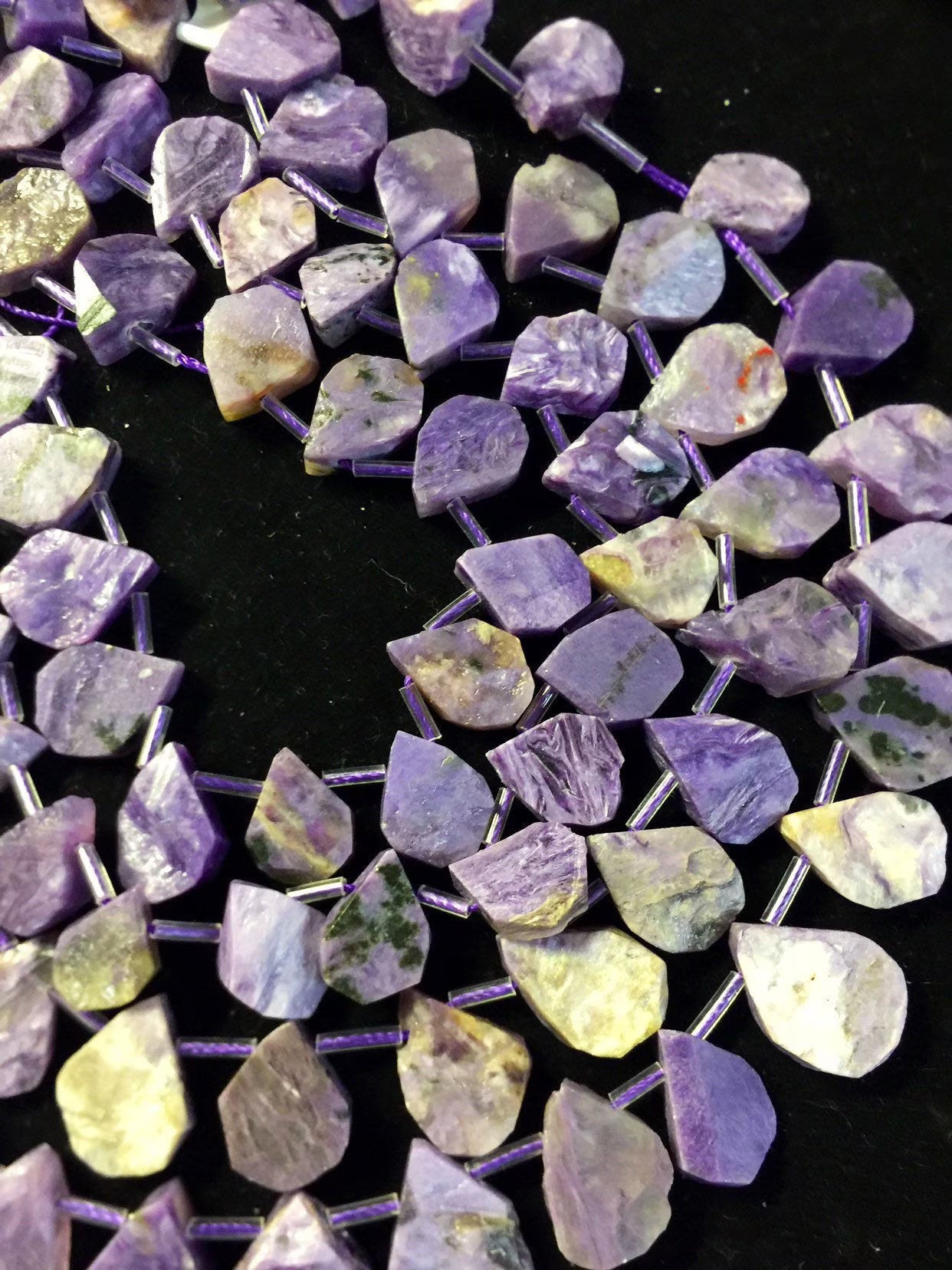 Natural Charoite beads teardrop shape 11x15mm natural Charoite gemstone color . Guaranteed 100% natural Charlotte bead . Full strand 15.5”