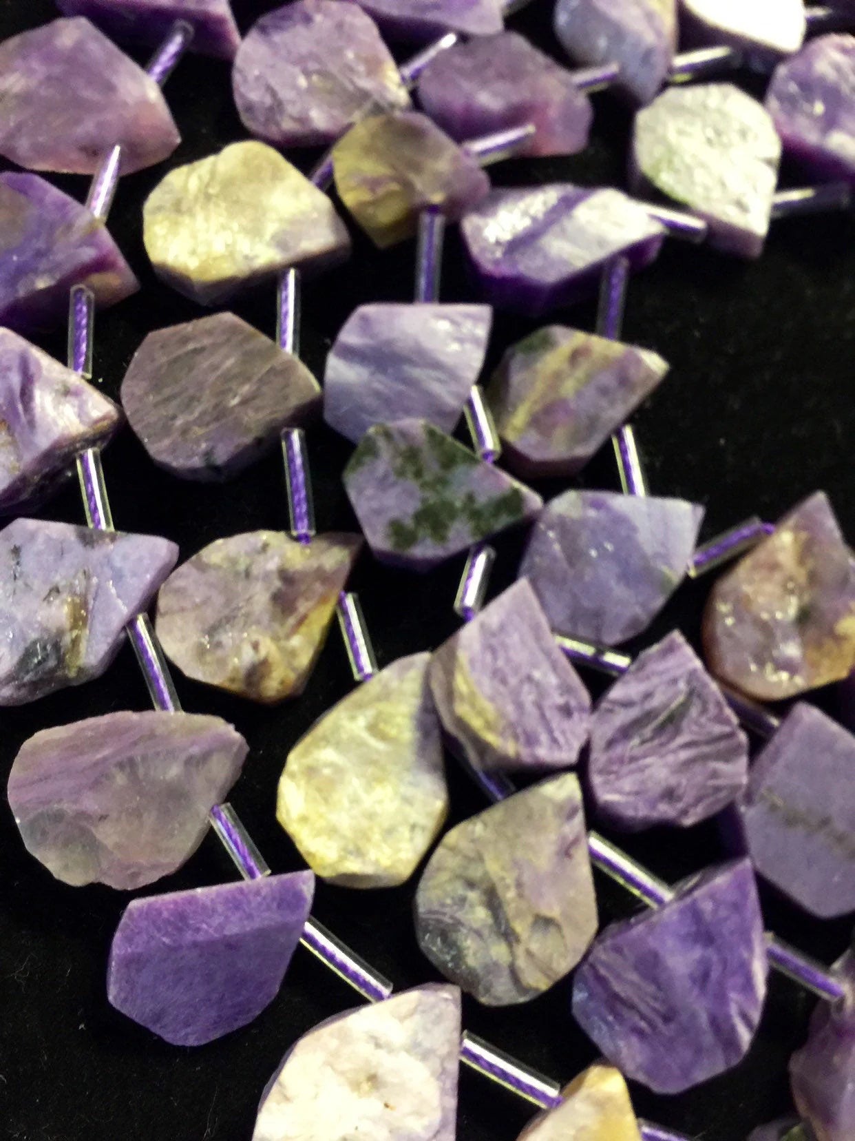 Natural Charoite beads teardrop shape 11x15mm natural Charoite gemstone color . Guaranteed 100% natural Charlotte bead . Full strand 15.5”