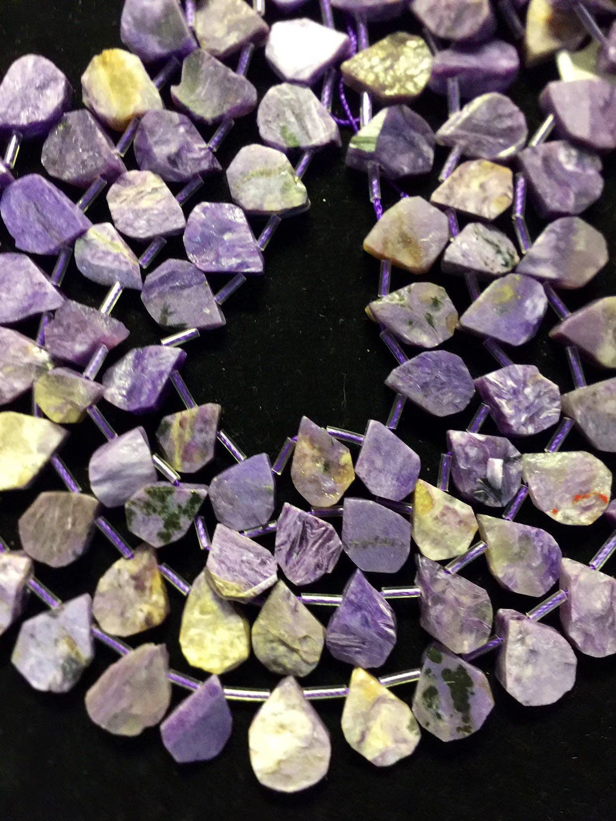 Natural Charoite beads teardrop shape 11x15mm natural Charoite gemstone color . Guaranteed 100% natural Charlotte bead . Full strand 15.5”