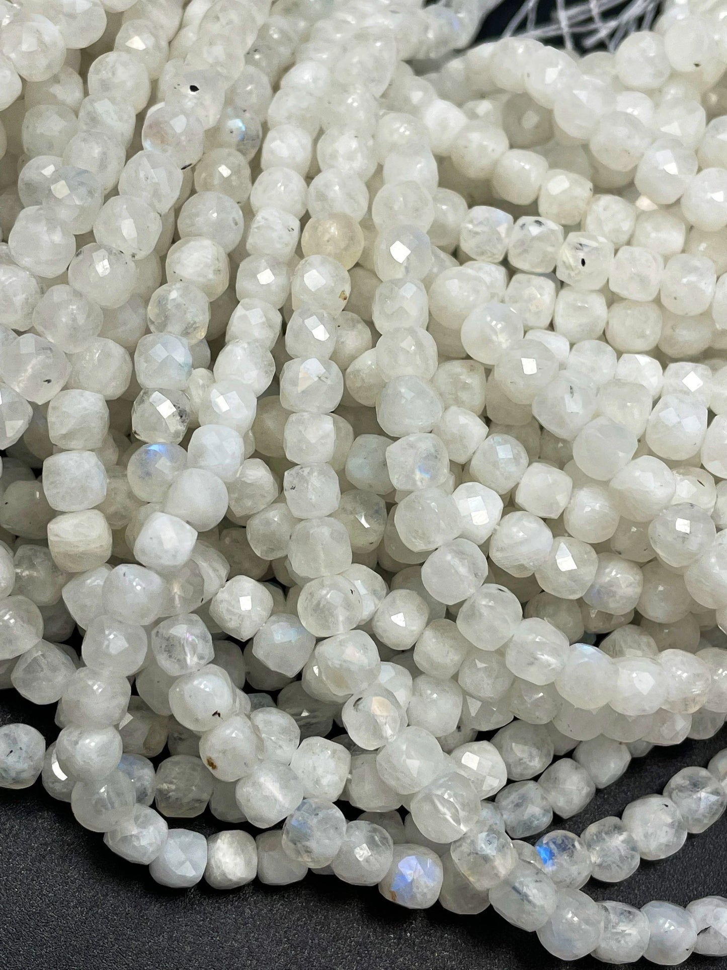 AA natural moonstone bead . Faceted 5mm cube shape bead. Beautiful natural white moonstone with blue flash on . High quality gemstone bead