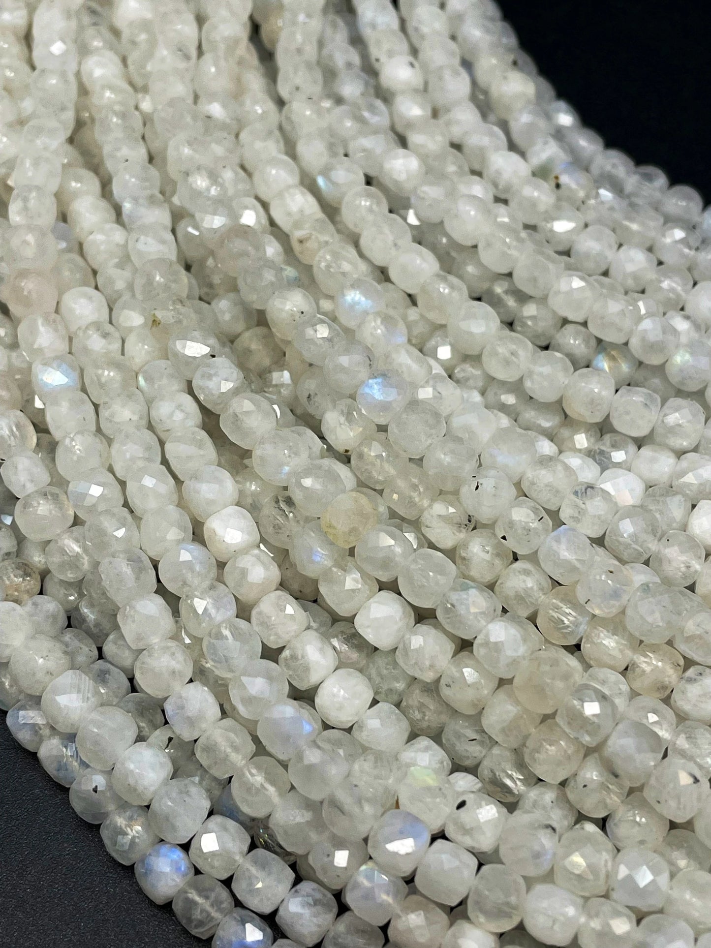 AA natural moonstone bead . Faceted 5mm cube shape bead. Beautiful natural white moonstone with blue flash on . High quality gemstone bead