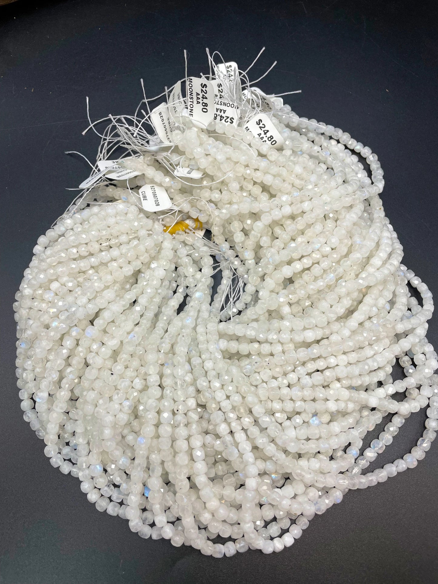 AA natural moonstone bead . Faceted 5mm cube shape bead. Beautiful natural white moonstone with blue flash on . High quality gemstone bead
