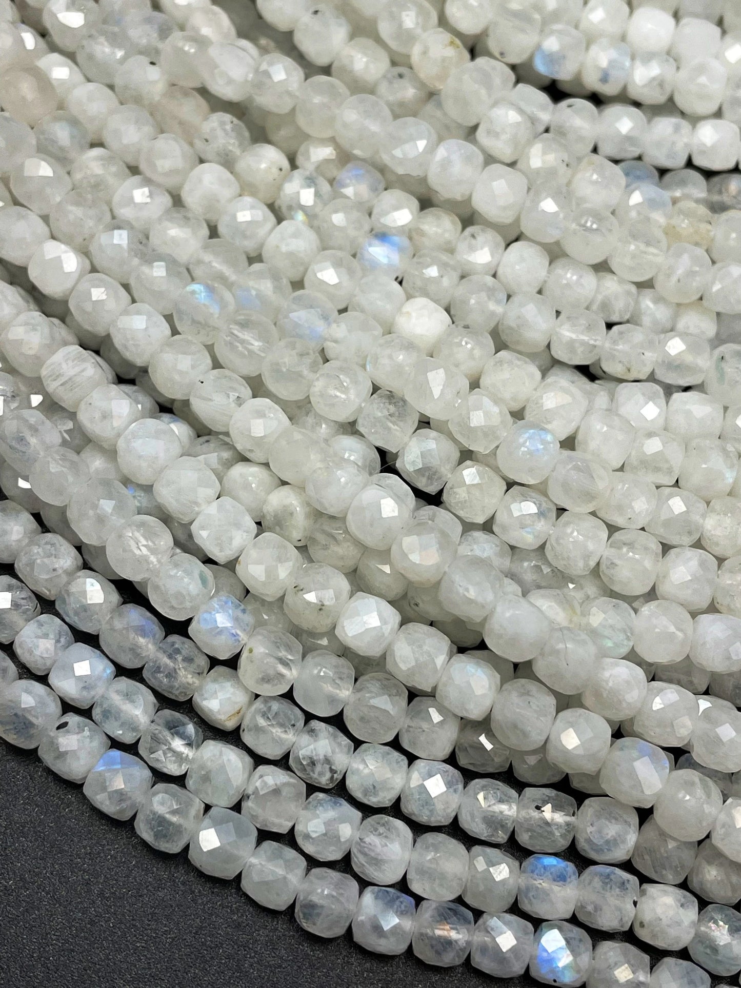 AA natural moonstone bead . Faceted 5mm cube shape bead. Beautiful natural white moonstone with blue flash on . High quality gemstone bead