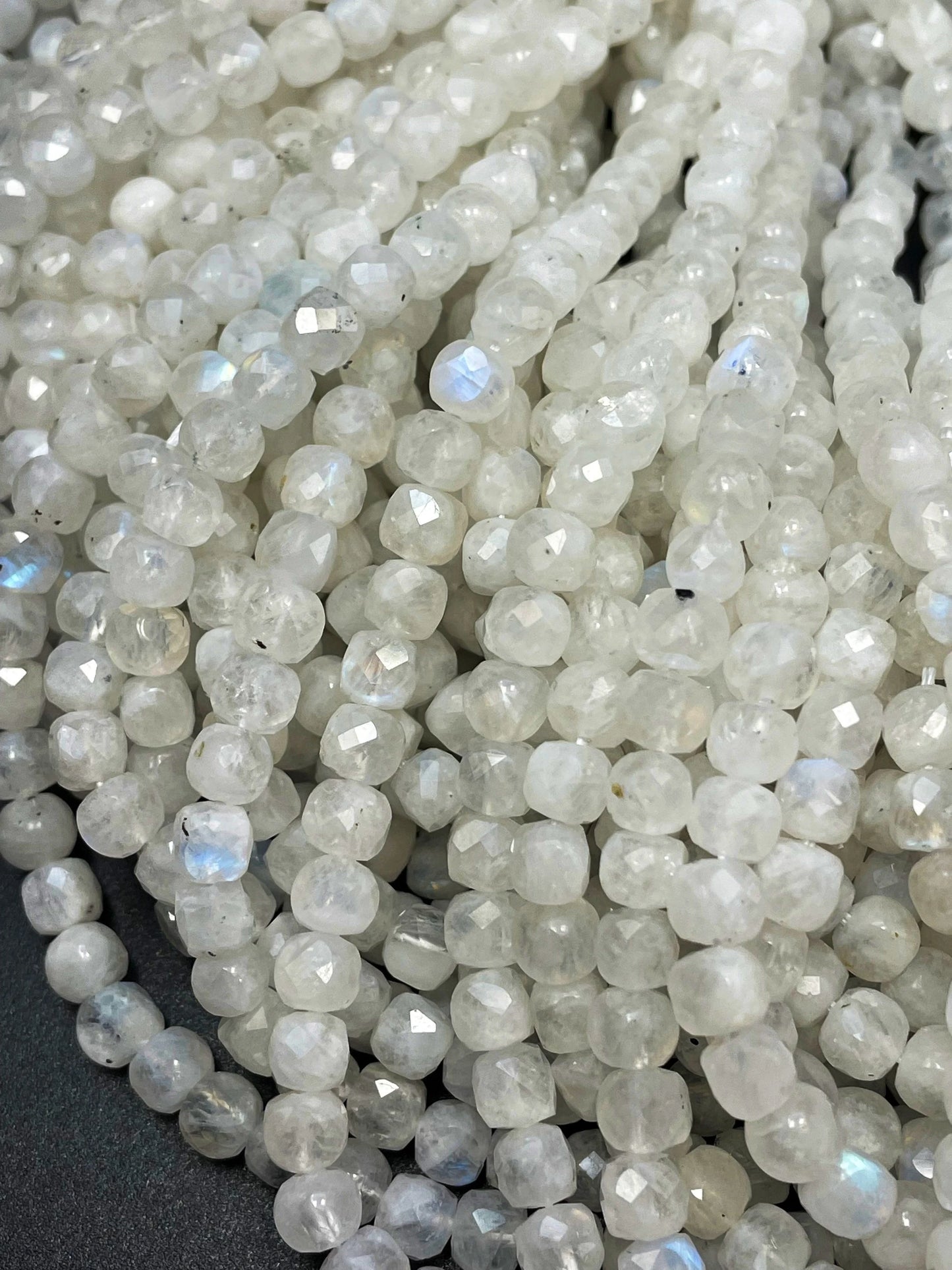 AA natural moonstone bead . Faceted 5mm cube shape bead. Beautiful natural white moonstone with blue flash on . High quality gemstone bead