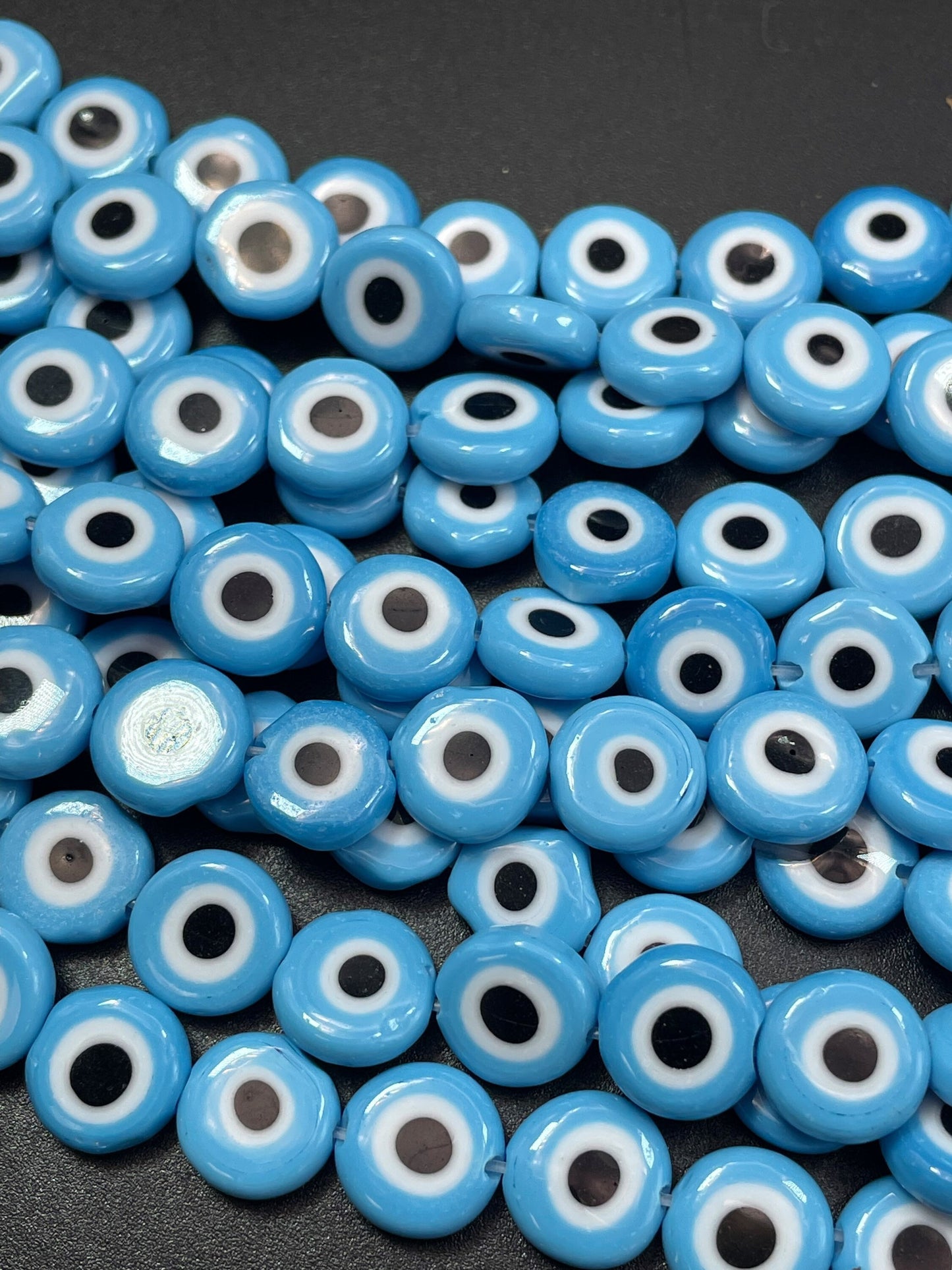 Beautiful Evil eye glass crystal beads . Religious amulet prayer beads . 10mm flat Coin shape Beautiful blue black color. Lucky eye