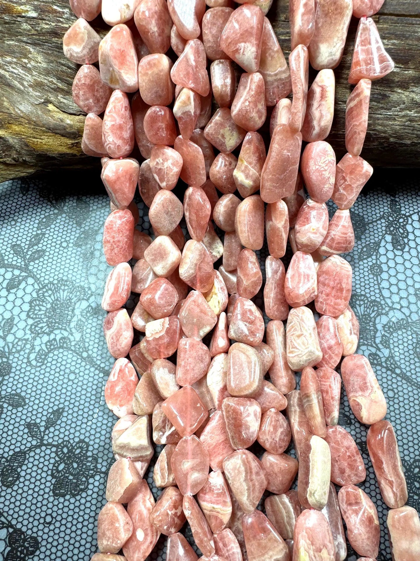 AA natural rhodochrosite stone bead. Gorgeous natural freedom nugget shape. natural pink color rhodochrosite expands quality full strand