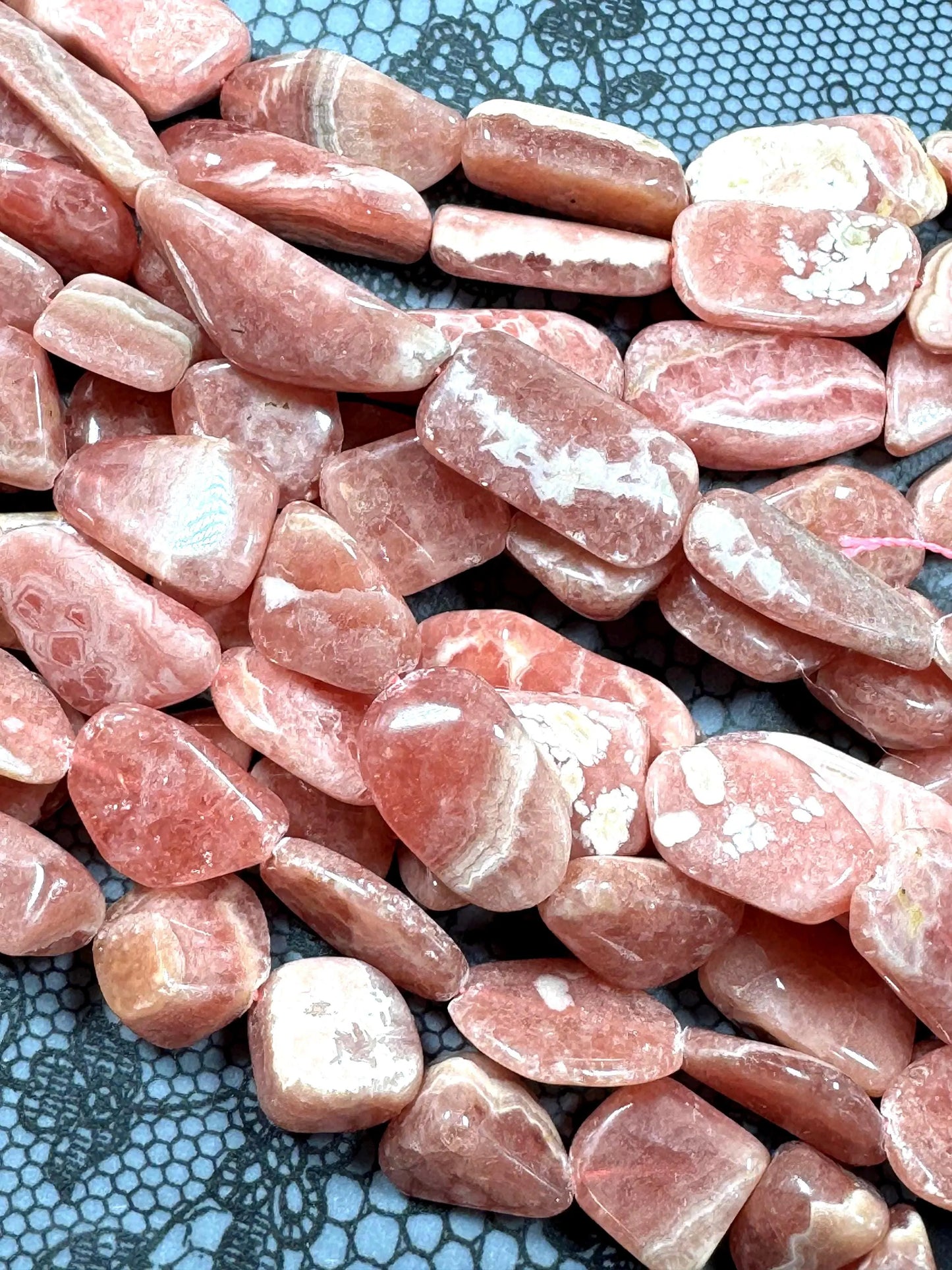 AA natural rhodochrosite stone bead. Gorgeous natural freedom nugget shape. natural pink color rhodochrosite expands quality full strand