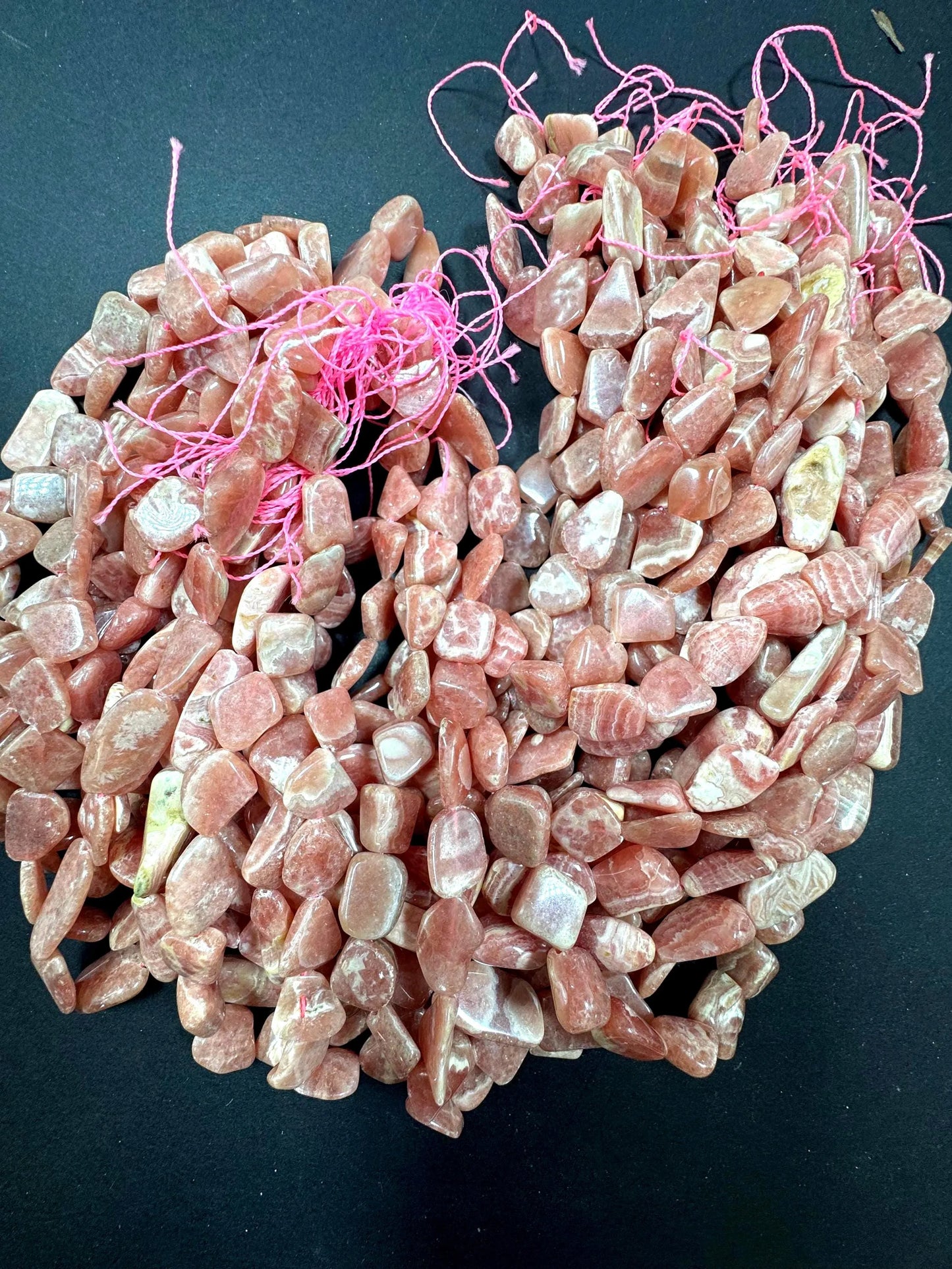 AA natural rhodochrosite stone bead. Gorgeous natural freedom nugget shape. natural pink color rhodochrosite expands quality full strand