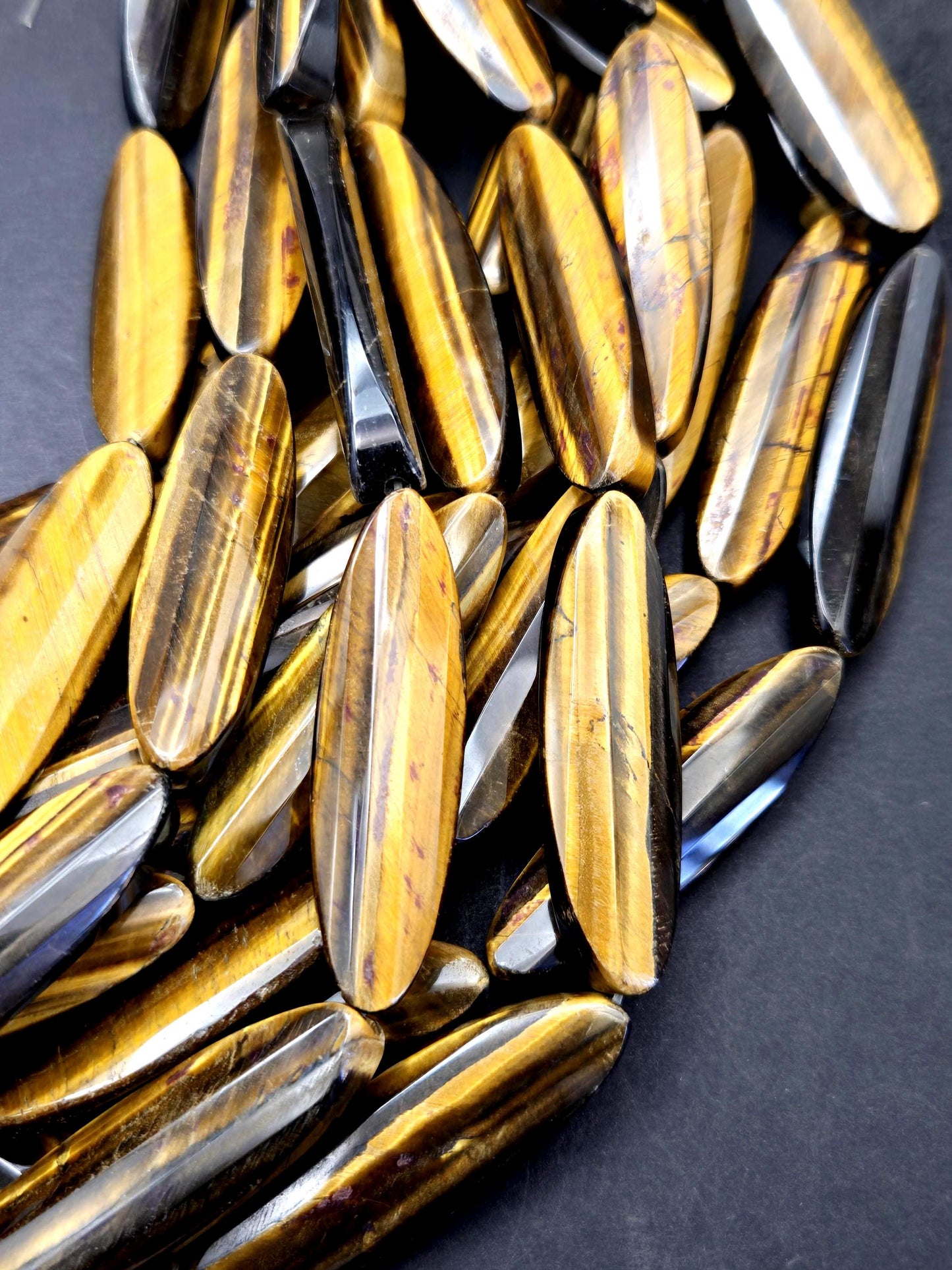 AAA Natural tiger eye faceted oval strips stone bead . .Gorgeous golden brown color tiger eye . Great quality gemstone . 15.5” 14x50mm