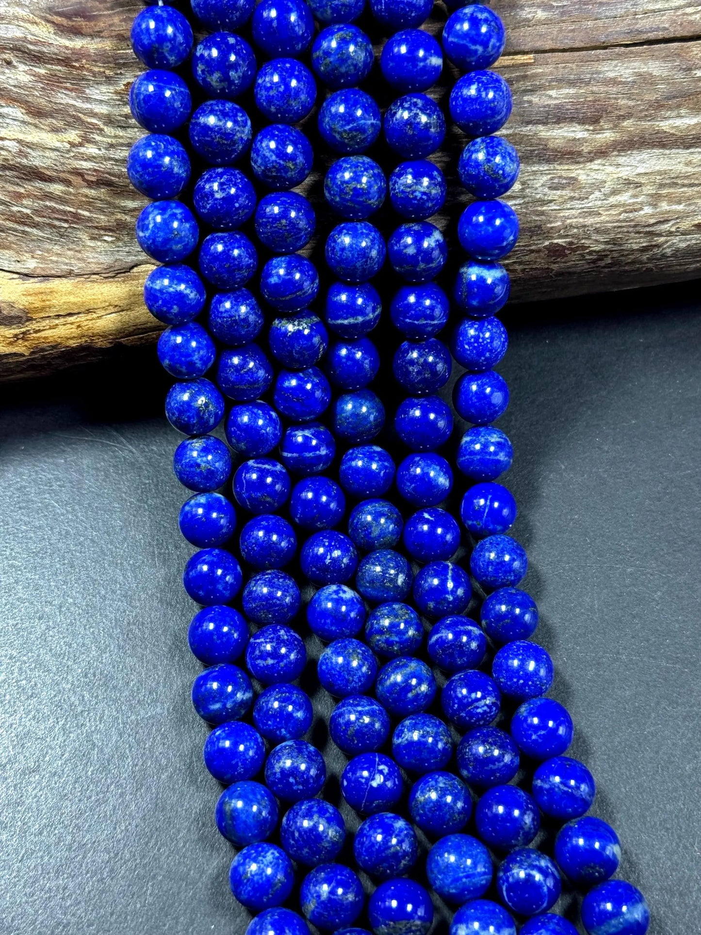 100% Natural lapis lazuli gemstone bead. smooth round beads. gorgeous natural royal blue color. not treated . excellent quality .full strand