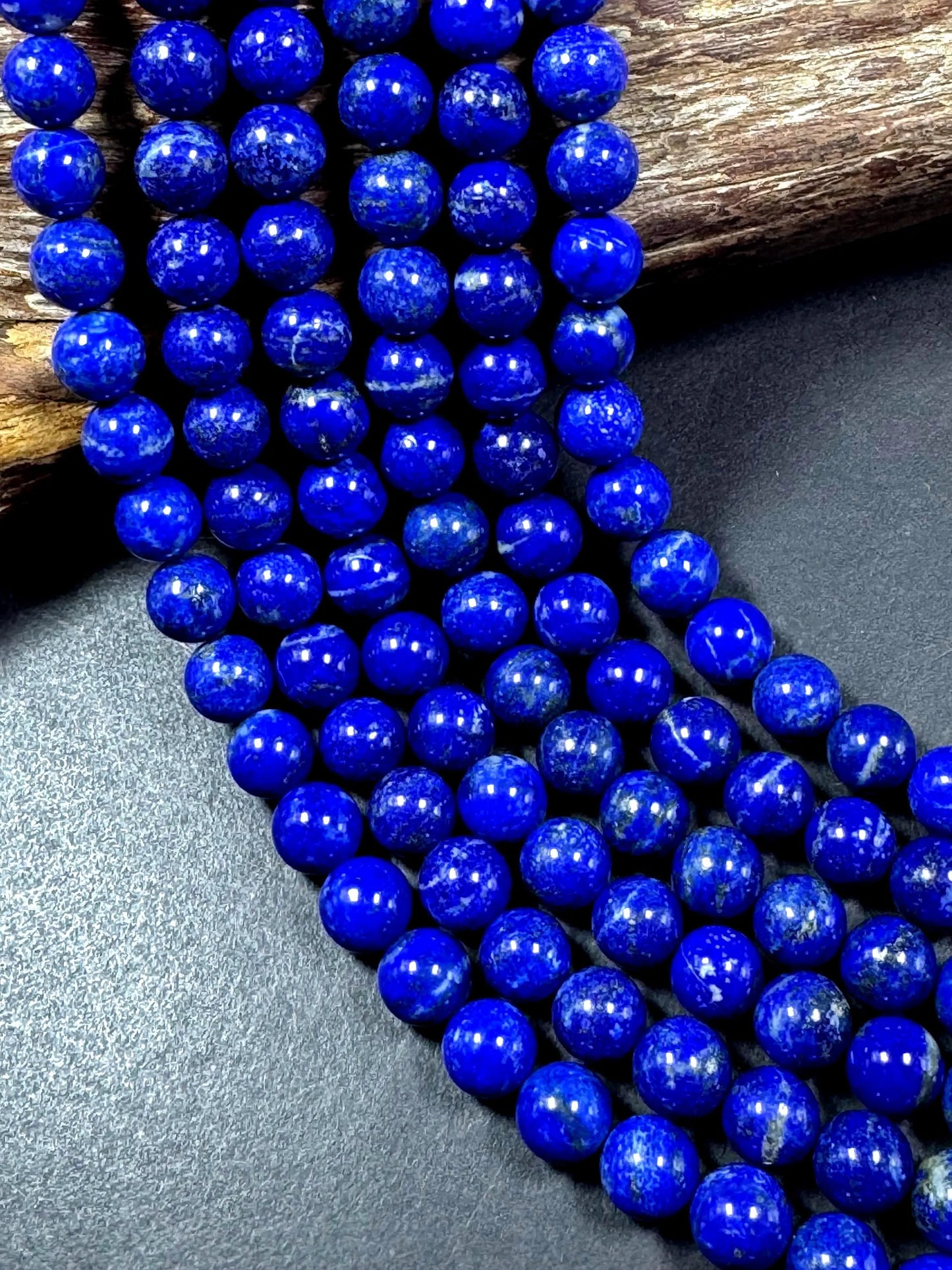 100% Natural lapis lazuli gemstone bead. smooth round beads. gorgeous natural royal blue color. not treated . excellent quality .full strand