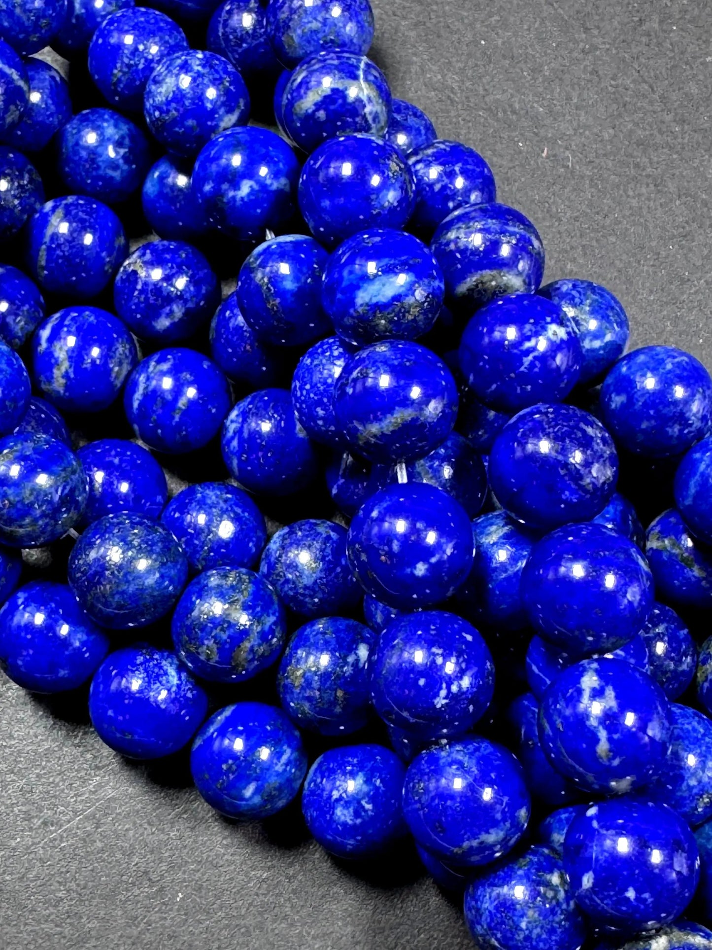 100% Natural lapis lazuli gemstone bead. smooth round beads. gorgeous natural royal blue color. not treated . excellent quality .full strand