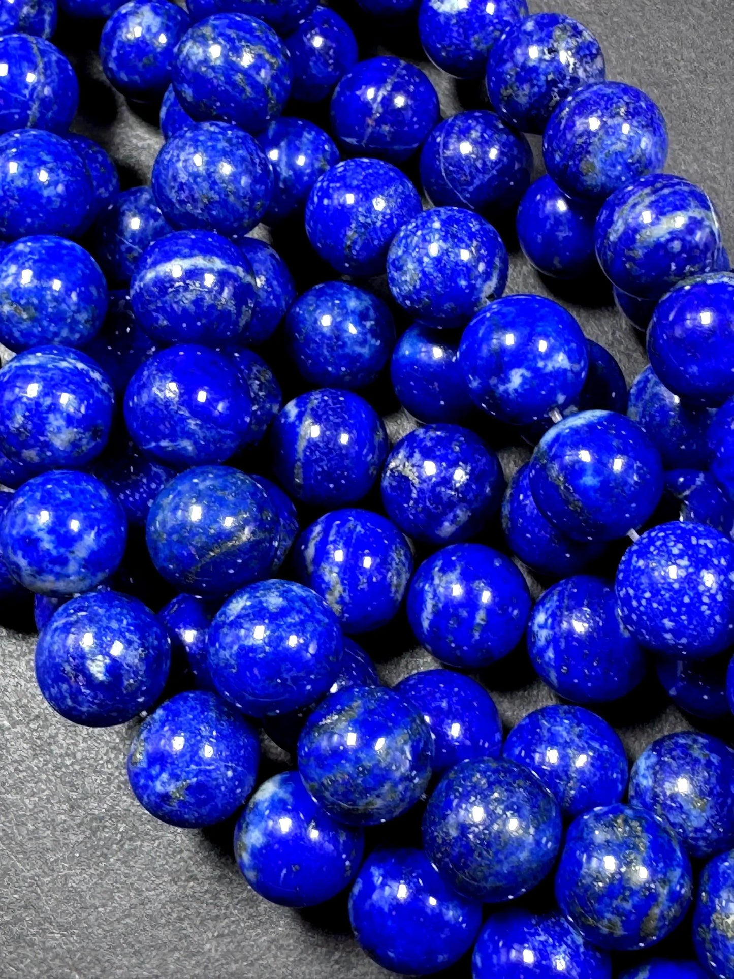 100% Natural lapis lazuli gemstone bead. smooth round beads. gorgeous natural royal blue color. not treated . excellent quality .full strand
