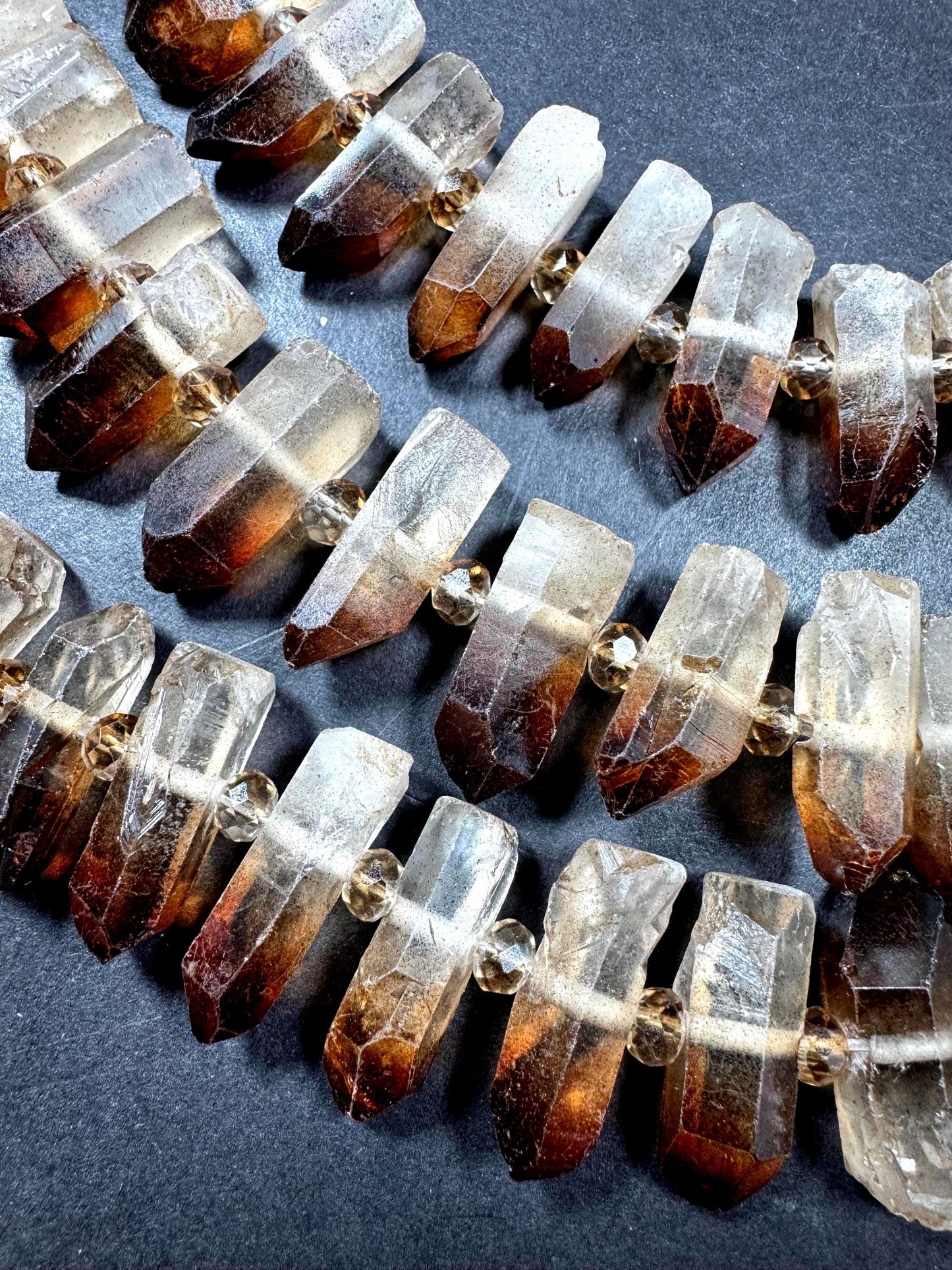100% Natural Rock Crystal Quartz. Freedom Teeth Shape. Clear Brown Color. Full Strand 15.5"