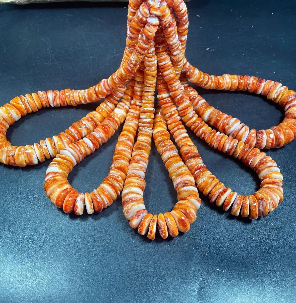 Natural spiny oyster shell beads . Gorgeous natural yellow orange color . Graduated . Excellent quality !