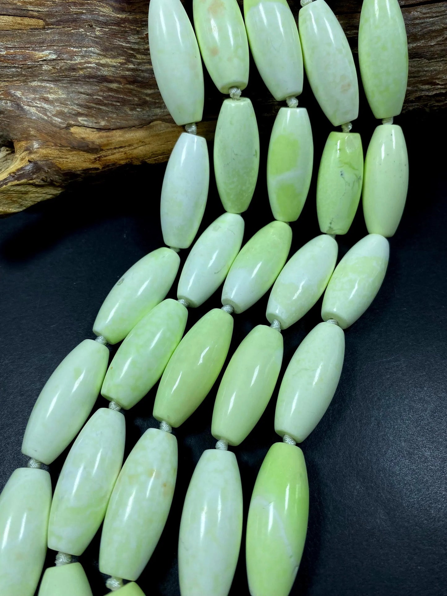 AAA natural Gaspeite bead. 16x39mm barrel shape. Gorgeous turquoise lemon color. High polished gemstone bead. Real nice quality!