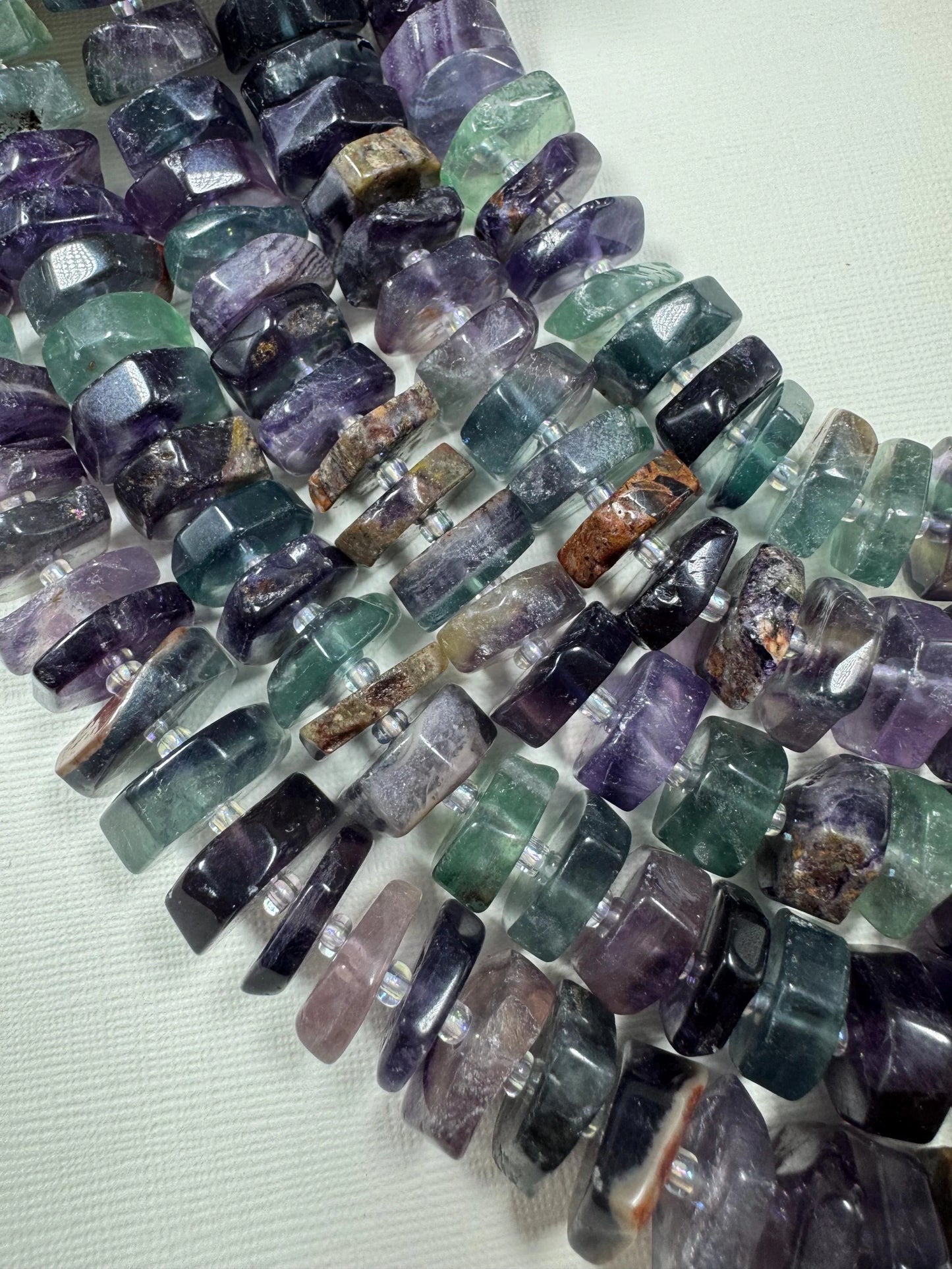 Natural fluorite gemstone beads. pinwheel shape . gorgeous natural color. not treated . excellent quality. full strand 15.5”